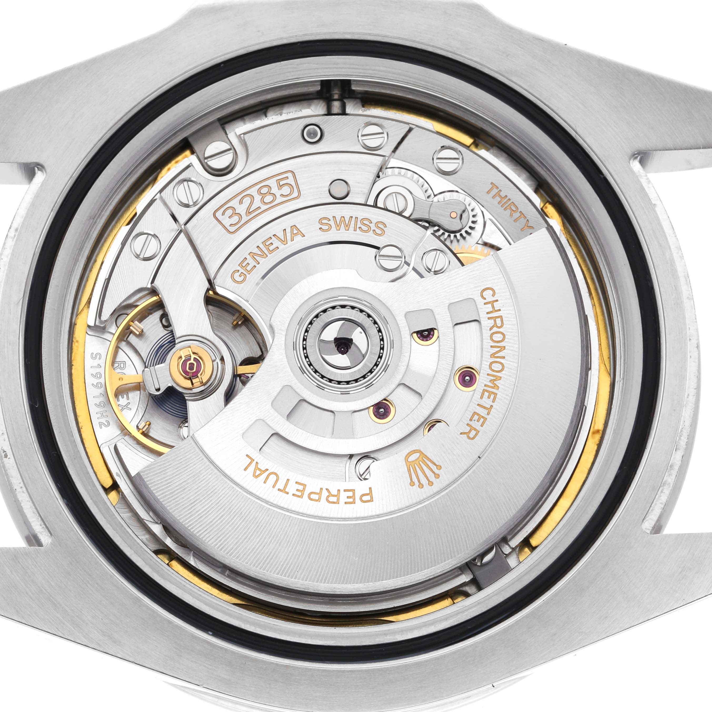 The image shows the back side of the Rolex Explorer 226570 Men's Stainless Steel White Dial 226570 Men's Stainless Steel White Dial, highlighting its intricate movement mechanism.