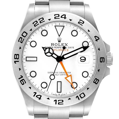 The image shows the face of the Rolex Explorer II watch, highlighting the dial, hands, bezel, and date window at an almost straight angle.