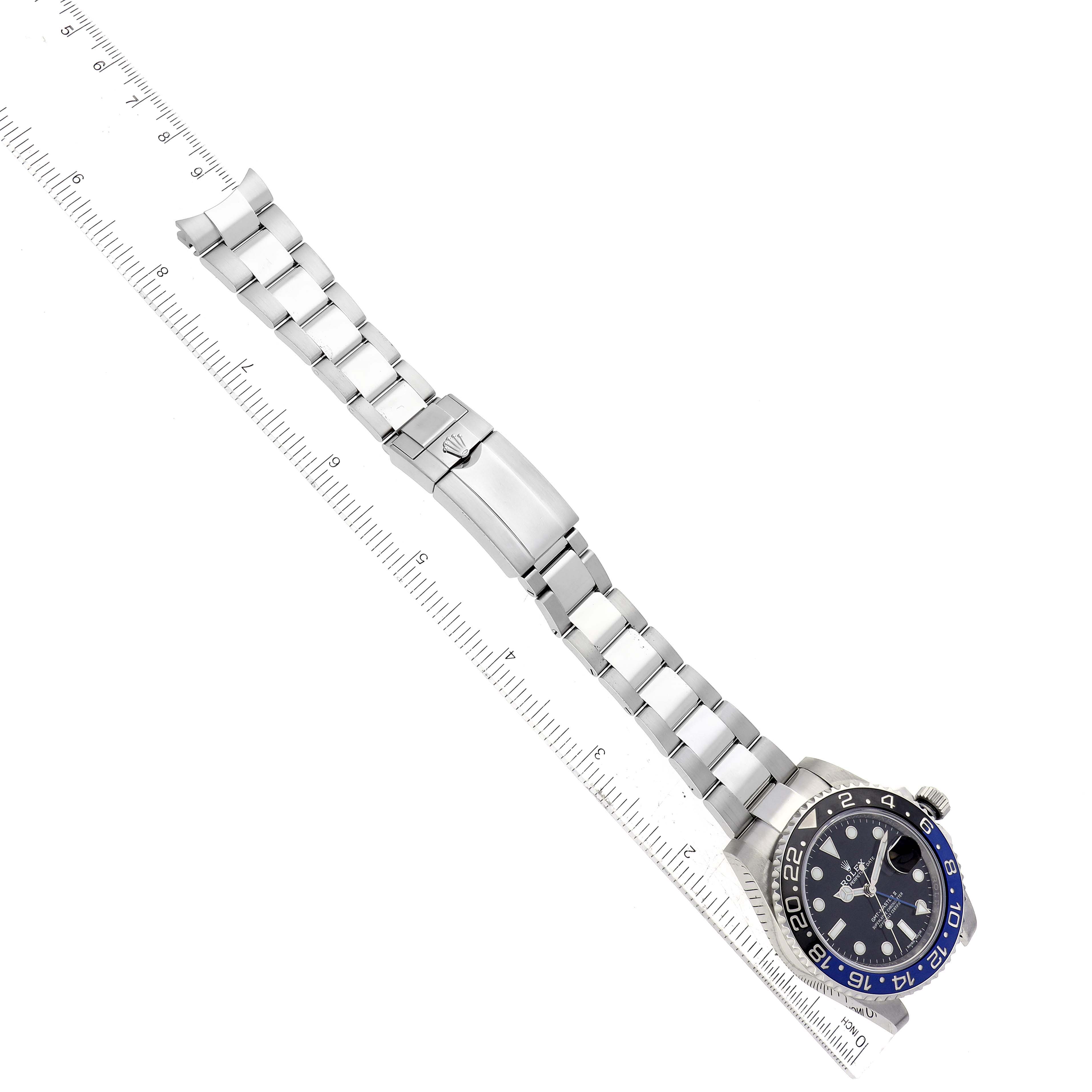 The image shows a top-down view of a Rolex GMT-Master 116710BLNR Men
s Stainless Steel Black Dial 116710BLNR Men
s Stainless Steel Black Dial watch, focusing on the bracelet, clasp, and part of the bezel.