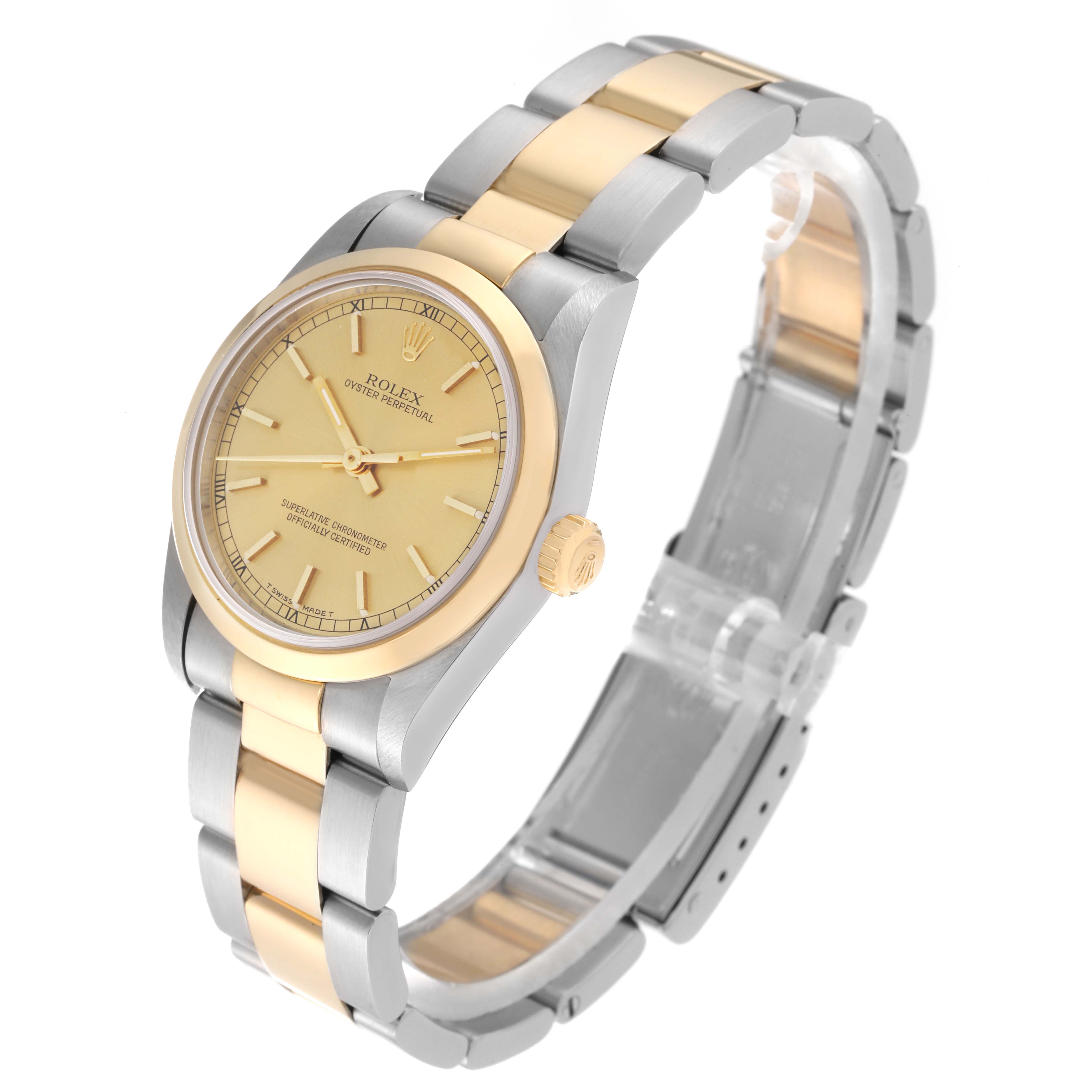 The image shows a three-quarter view of a Rolex Mid-Size 67483 Women's Steel and Gold (two tone) Champagne Dial 67483 Women's Steel and Gold (two tone) Champagne Dial Oyster Perpetual watch, highlighting the face, bezel, and two-tone bracelet.