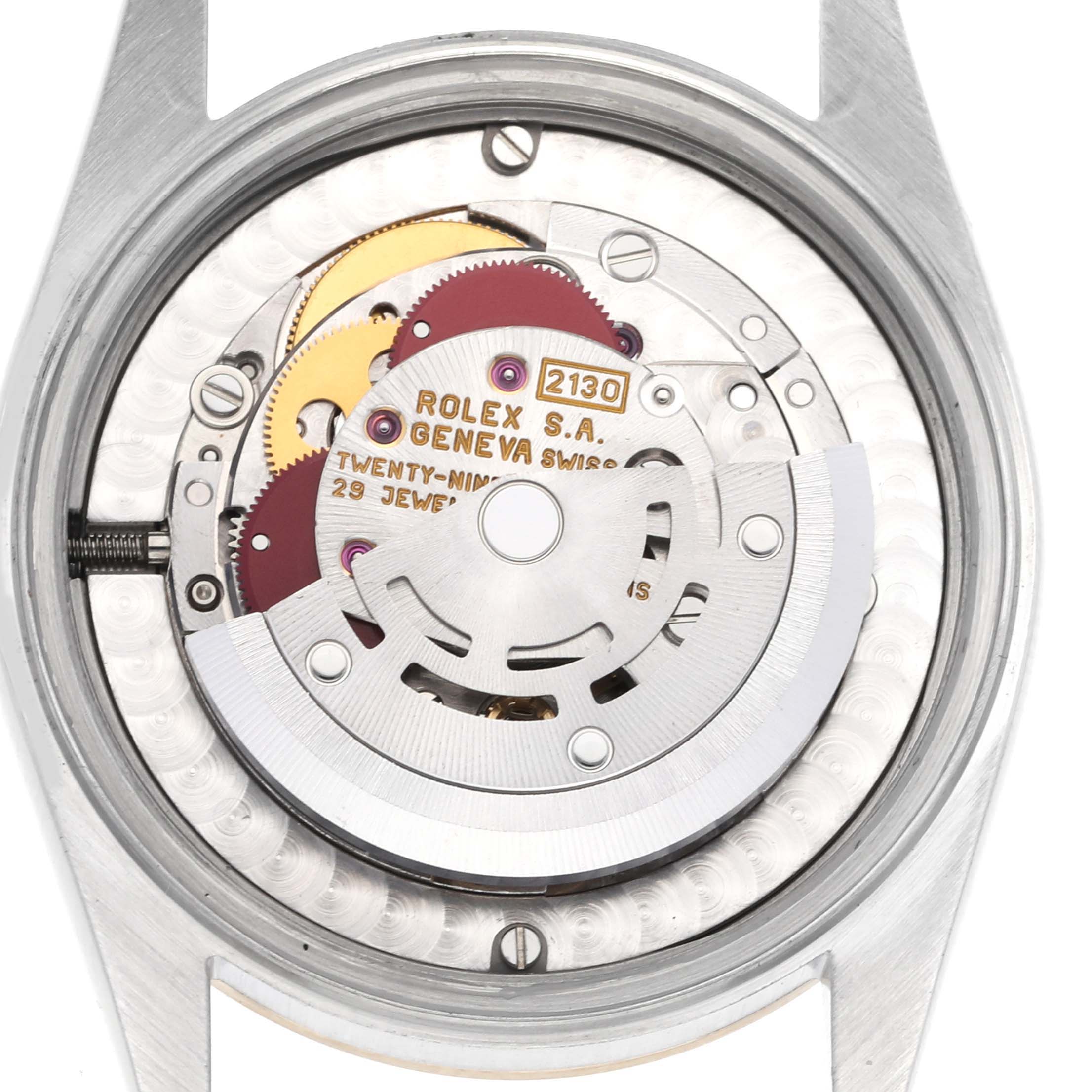 This image shows the internal mechanism and movement of a Rolex Mid-Size 67483 Women's Steel and Gold (two tone) Champagne Dial 67483 Women's Steel and Gold (two tone) Champagne Dial watch, viewed from the back.