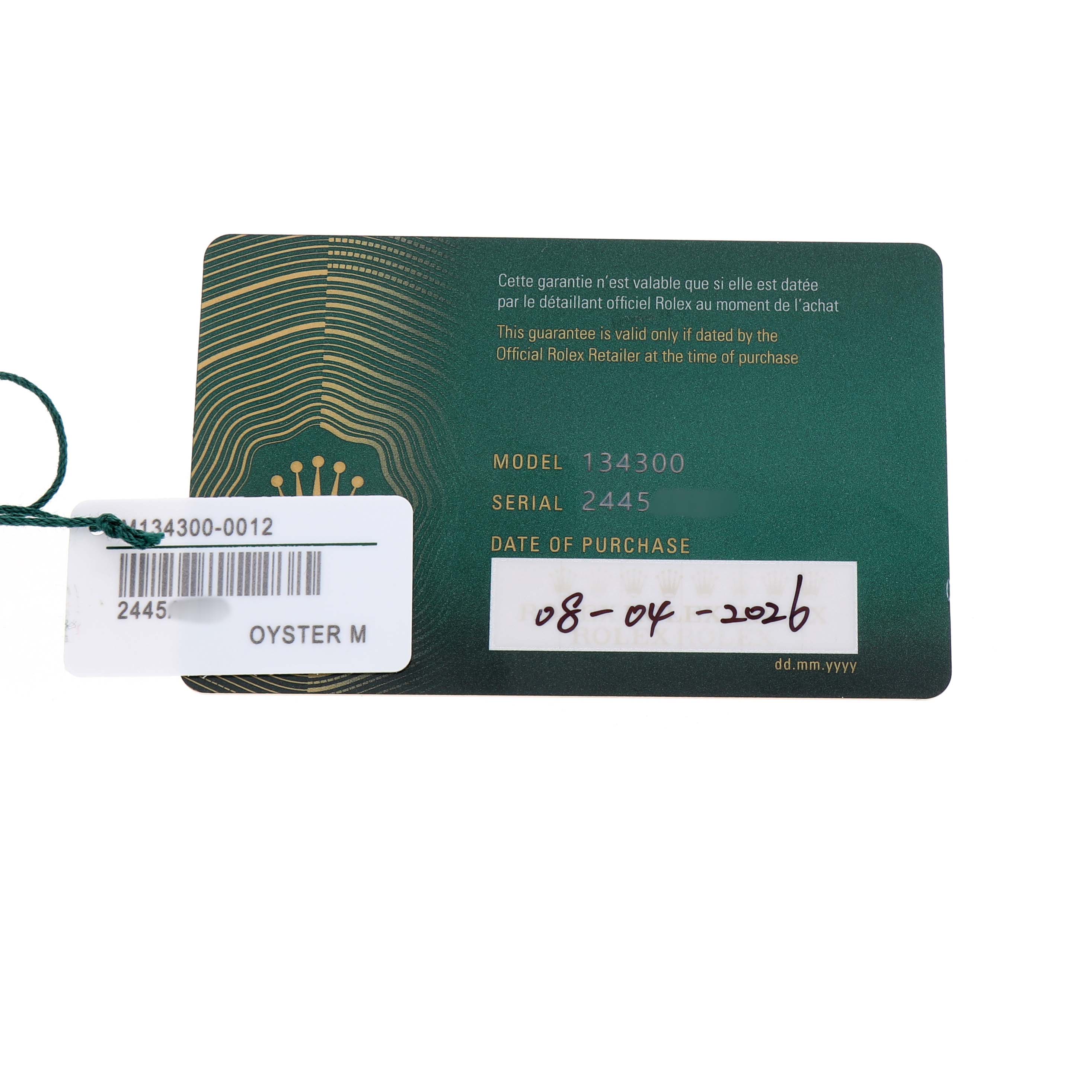 The image shows a Rolex Oyster Perpetual 134300 Men's Stainless Steel Purple Dial warranty card with model and serial numbers visible.