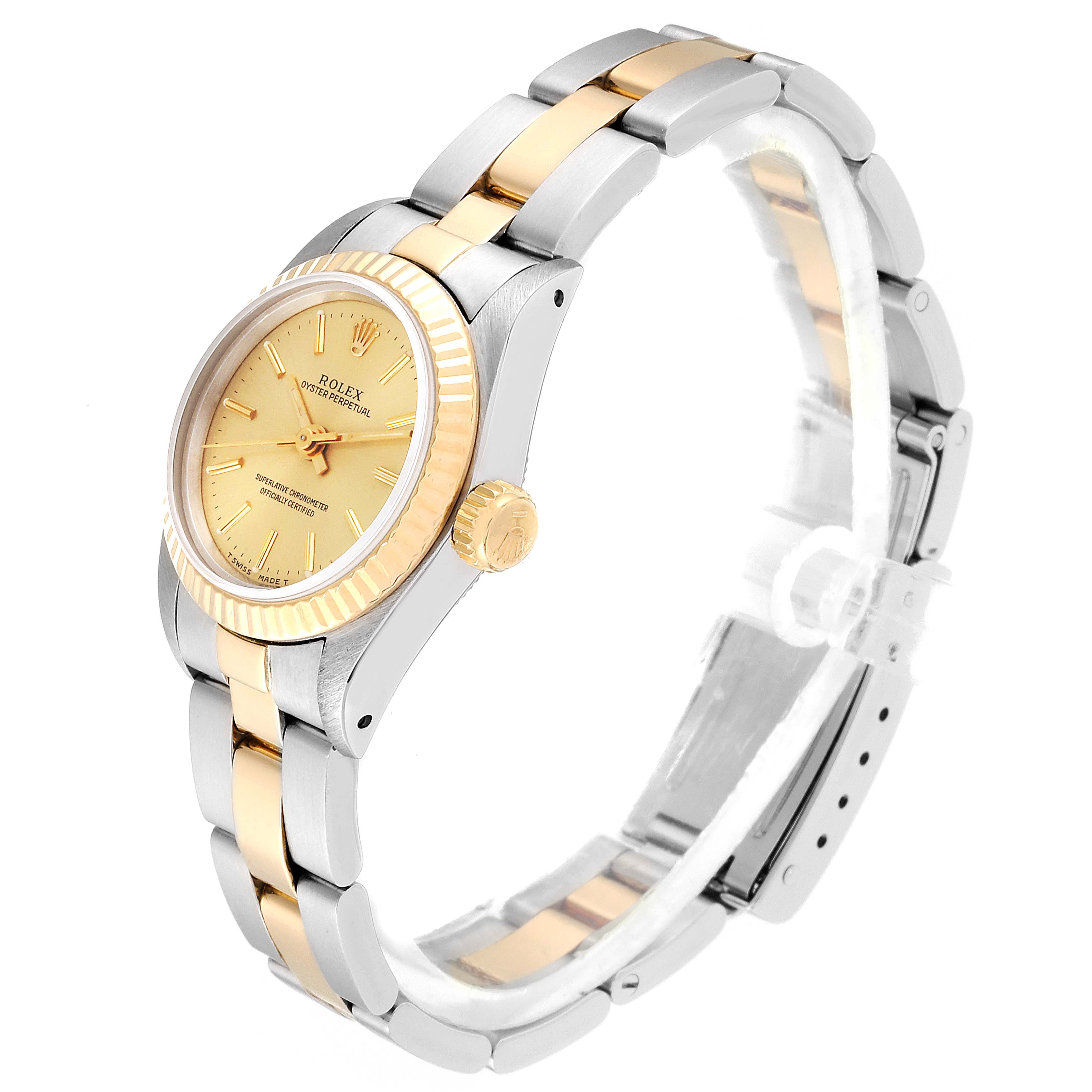 This image shows a side view of the Rolex Oyster Perpetual 67193 Women
s Steel and Gold (two tone) Champagne Dial 67193 Women
s Steel and Gold (two tone) Champagne Dial watch, highlighting the bracelet, bezel, and crown.