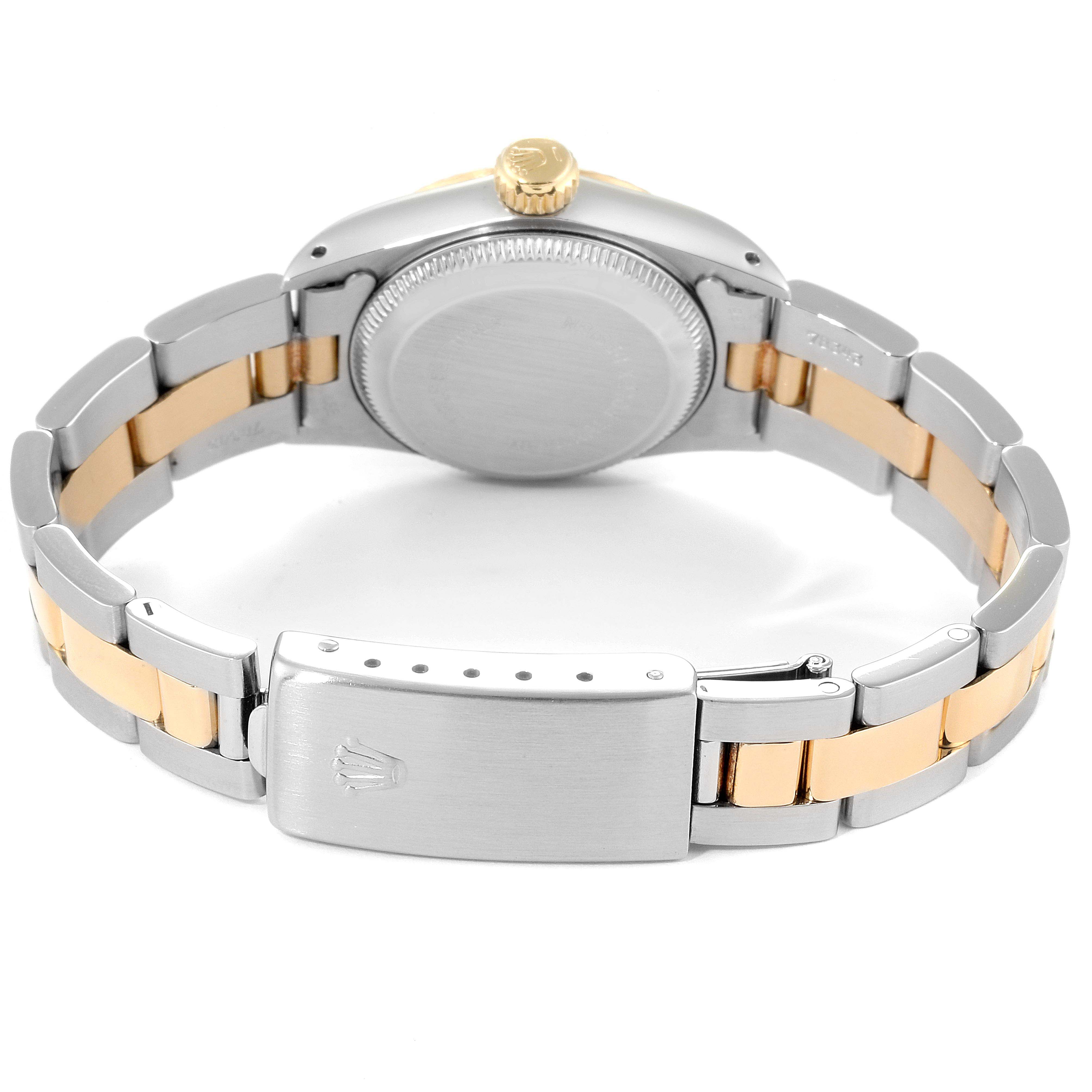 The image shows the back case and bracelet clasp of a Rolex Oyster Perpetual 67193 Women
s Steel and Gold (two tone) Champagne Dial 67193 Women
s Steel and Gold (two tone) Champagne Dial watch from a rear angle.