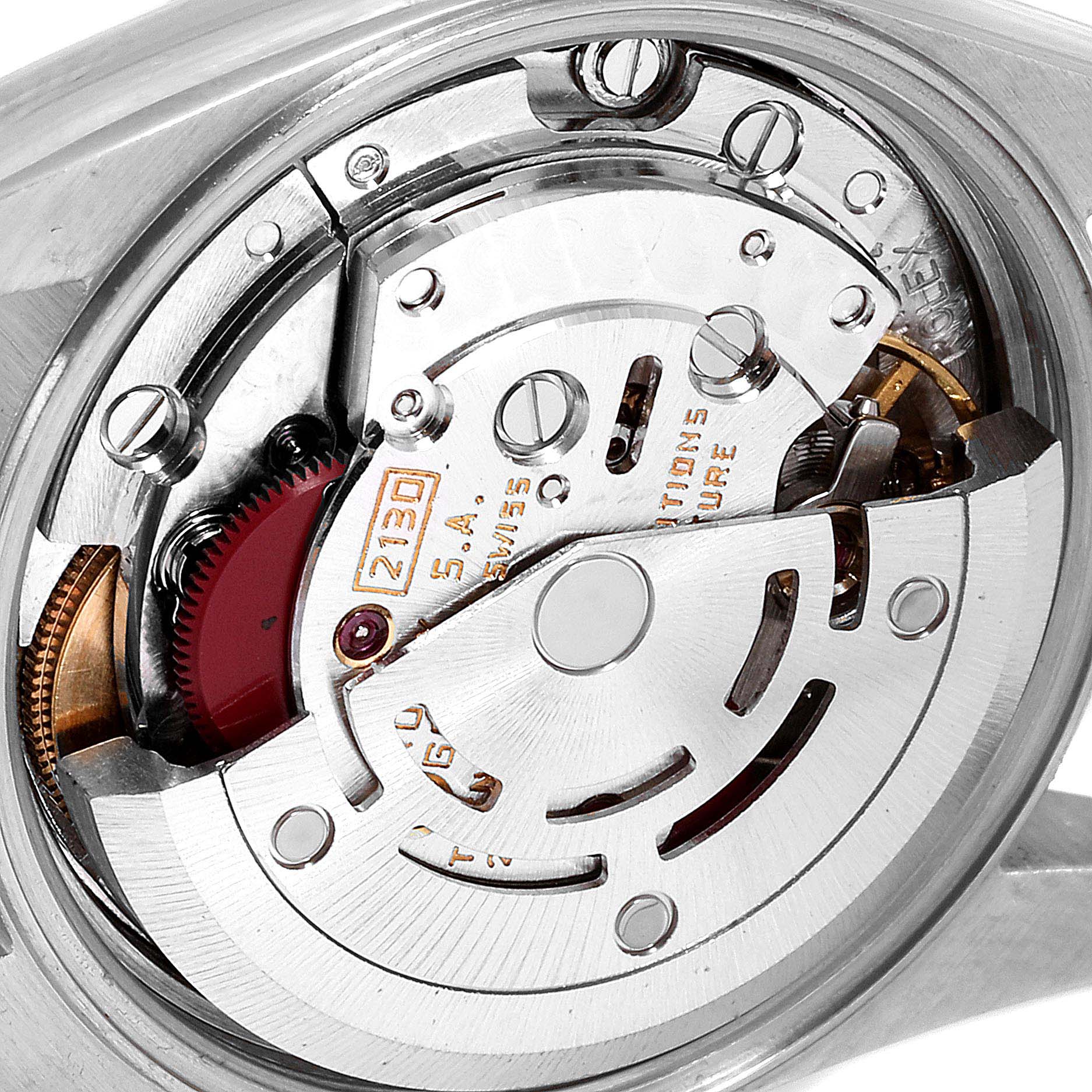 The image shows a close-up view of the back of the Rolex Oyster Perpetual 67193 Women
s Steel and Gold (two tone) Champagne Dial 67193 Women
s Steel and Gold (two tone) Champagne Dial watch, highlighting its intricate movement mechanism.