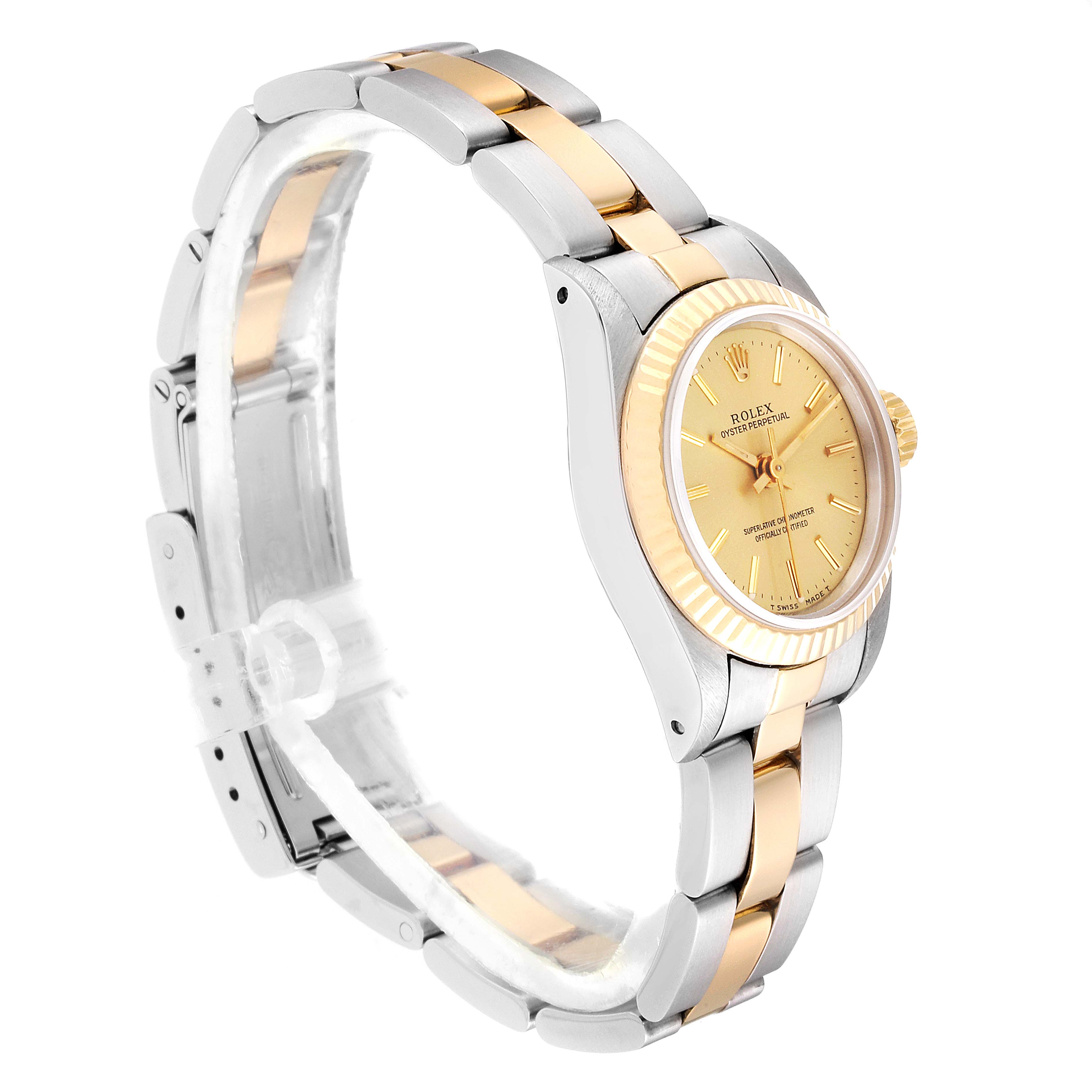 The image shows a side angle of a Rolex Oyster Perpetual 67193 Women
s Steel and Gold (two tone) Champagne Dial 67193 Women
s Steel and Gold (two tone) Champagne Dial, highlighting its two-tone bracelet and gold dial.