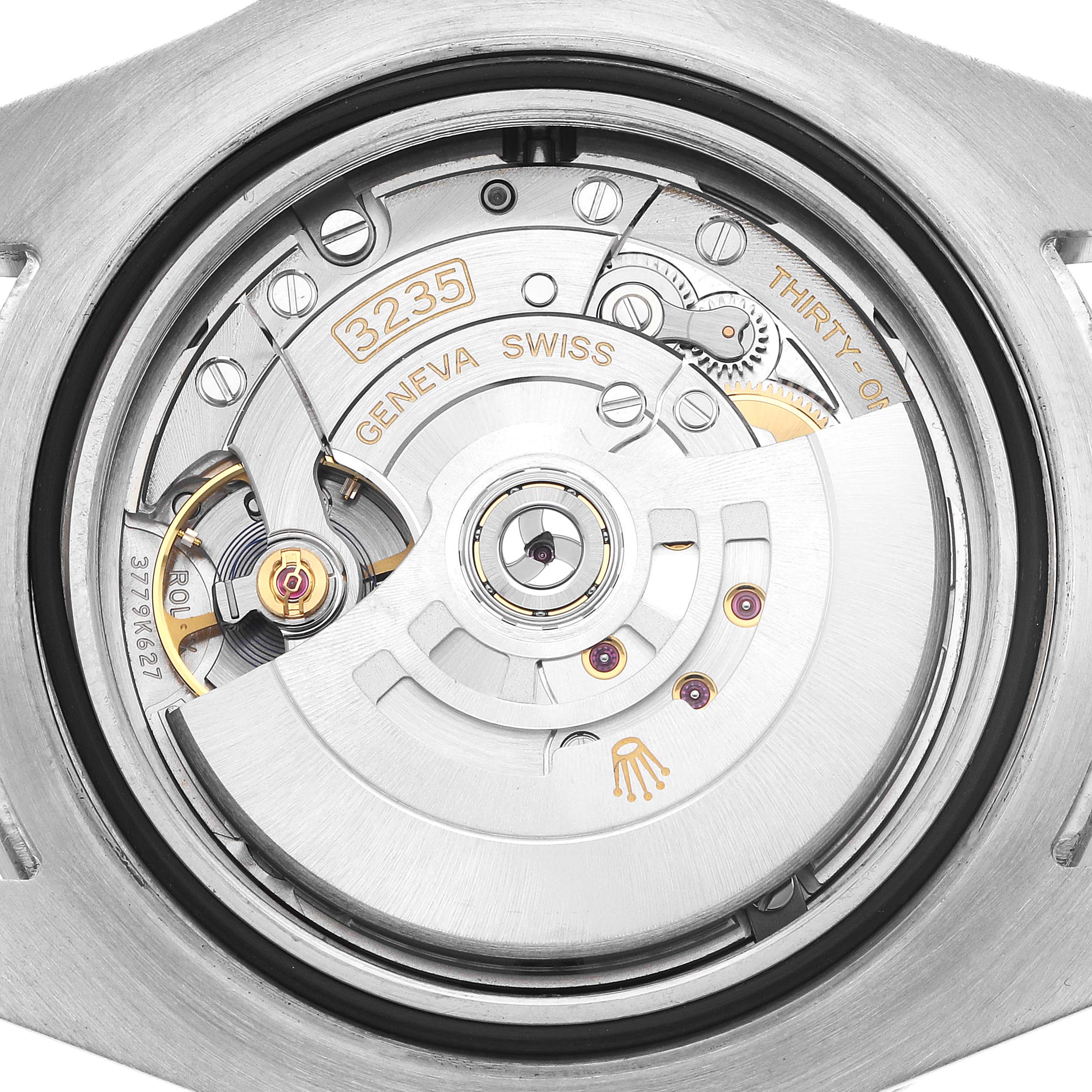 The image shows the movement of a Rolex Sea-Dweller model 126600, focusing on the intricate gears and mechanisms of the watch
s interior.