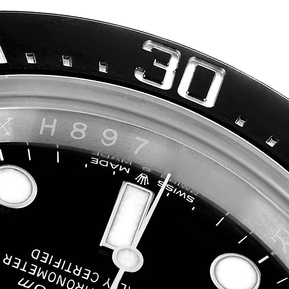 The image shows a close-up of the dial and bezel of the Rolex Sea-Dweller model 126600, highlighting the number "30" and part of the luminescent indices.