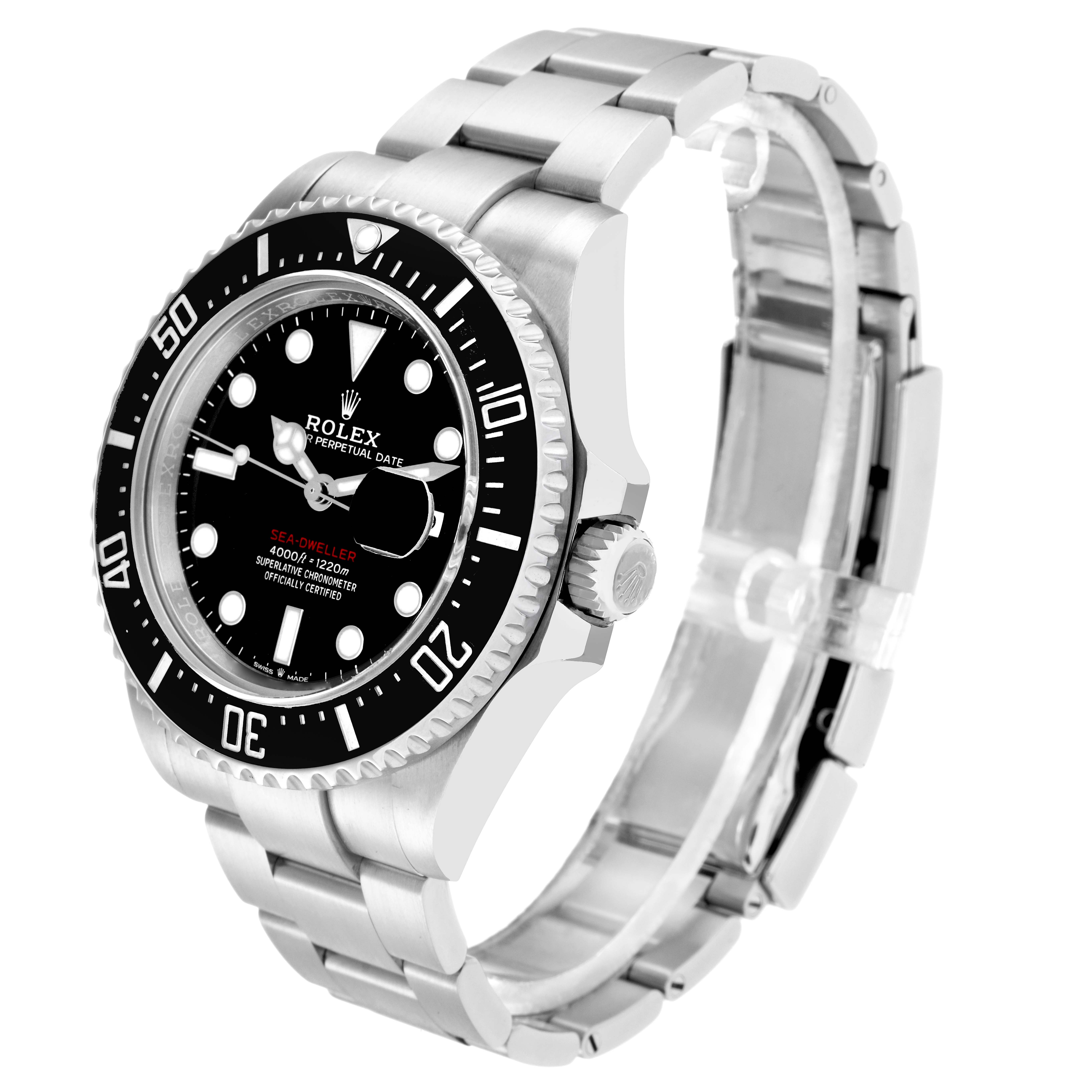 The image shows a Rolex Sea-Dweller model 126600 men
s watch at an angled view, displaying its dial, bezel, crown, and stainless steel bracelet.