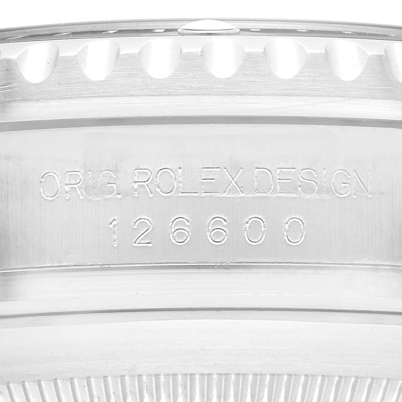 The image shows an engraved side view of the Rolex Sea-Dweller model 126600, focusing on the bezel and casing details.