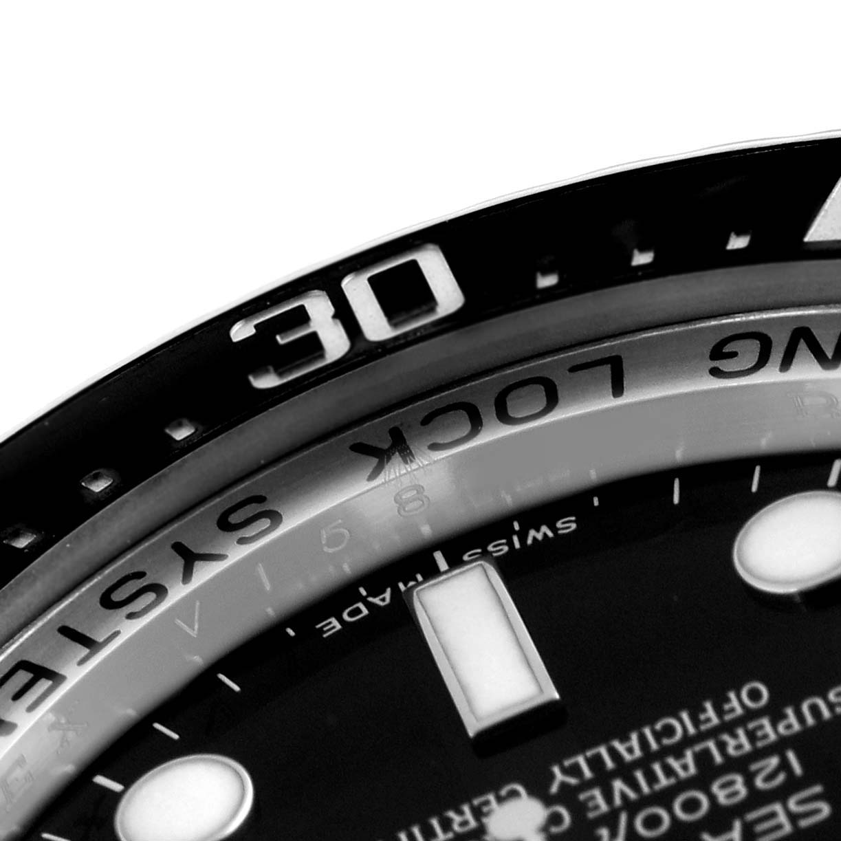 This image shows a close-up of the bezel and dial of a Rolex Sea-Dweller 116660 Men
s Stainless Steel Black Dial 116660 Men
s Stainless Steel Black Dial watch, highlighting the "30" minute marker and surrounding text.