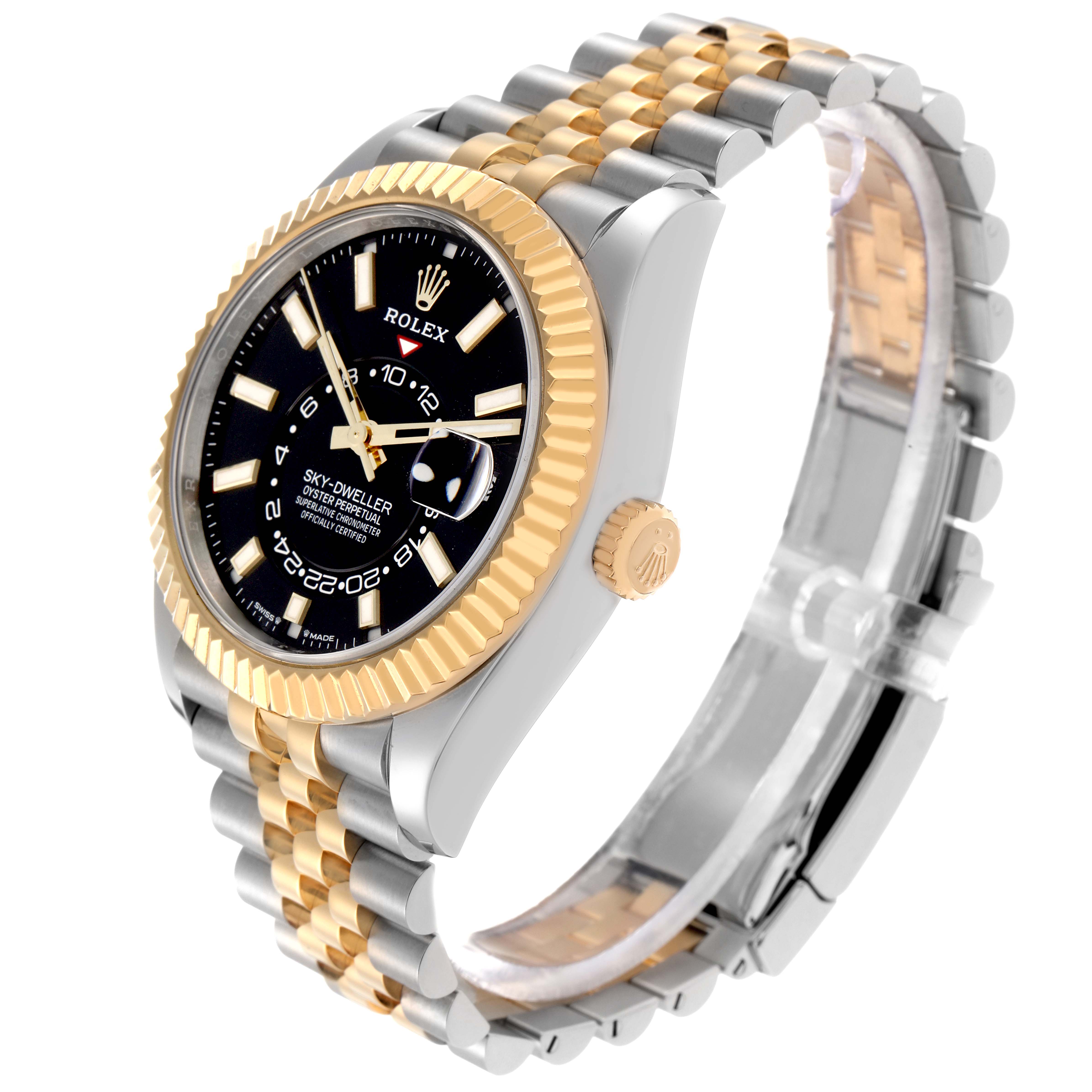 The Rolex Sky-Dweller model 336933 is shown at a side angle, displaying its two-tone bracelet, fluted bezel, crown, and a partially visible black dial.