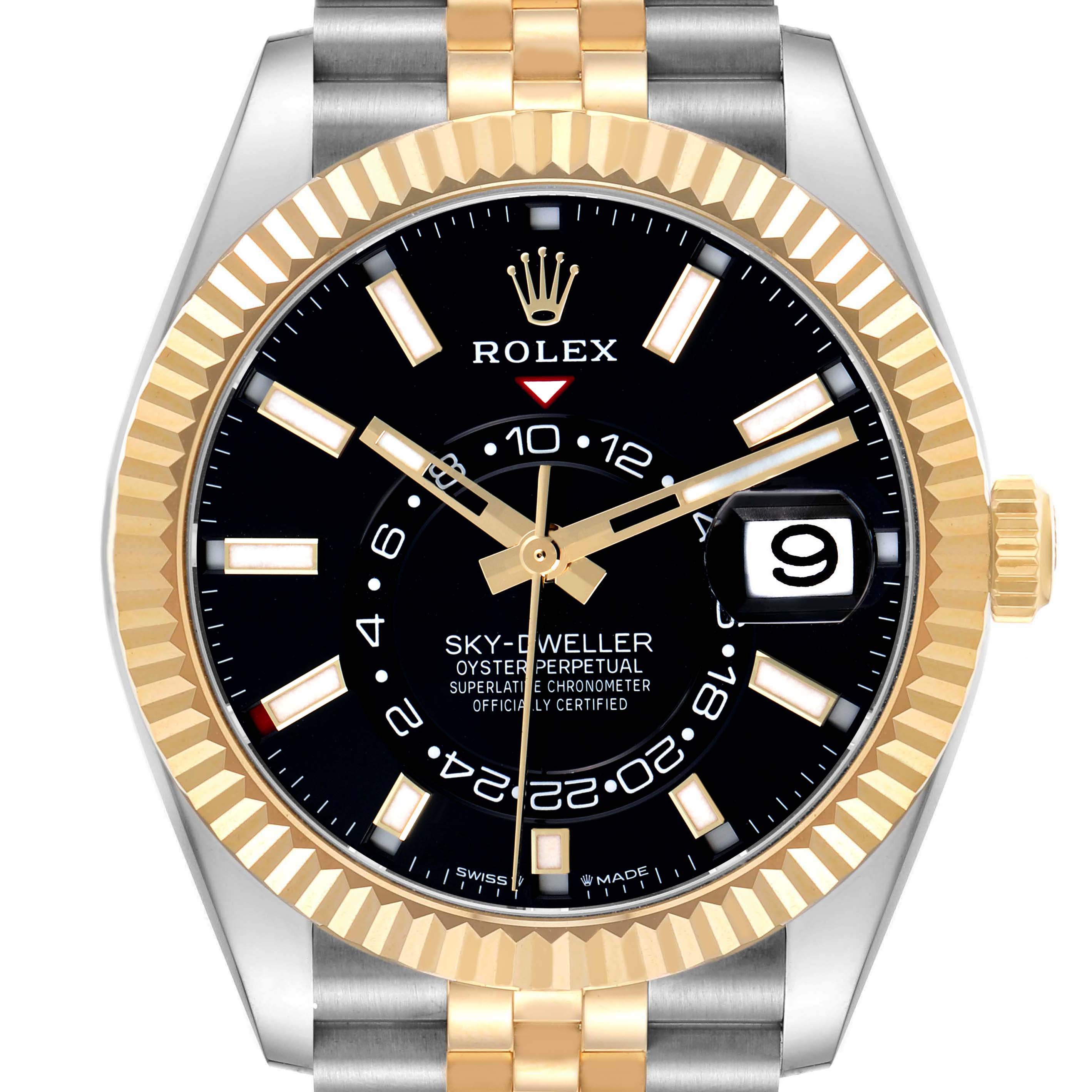 The Rolex Sky-Dweller model 336933 is shown from the front, highlighting the black dial, gold bezel, two-tone bracelet, and distinctive features like the date window.