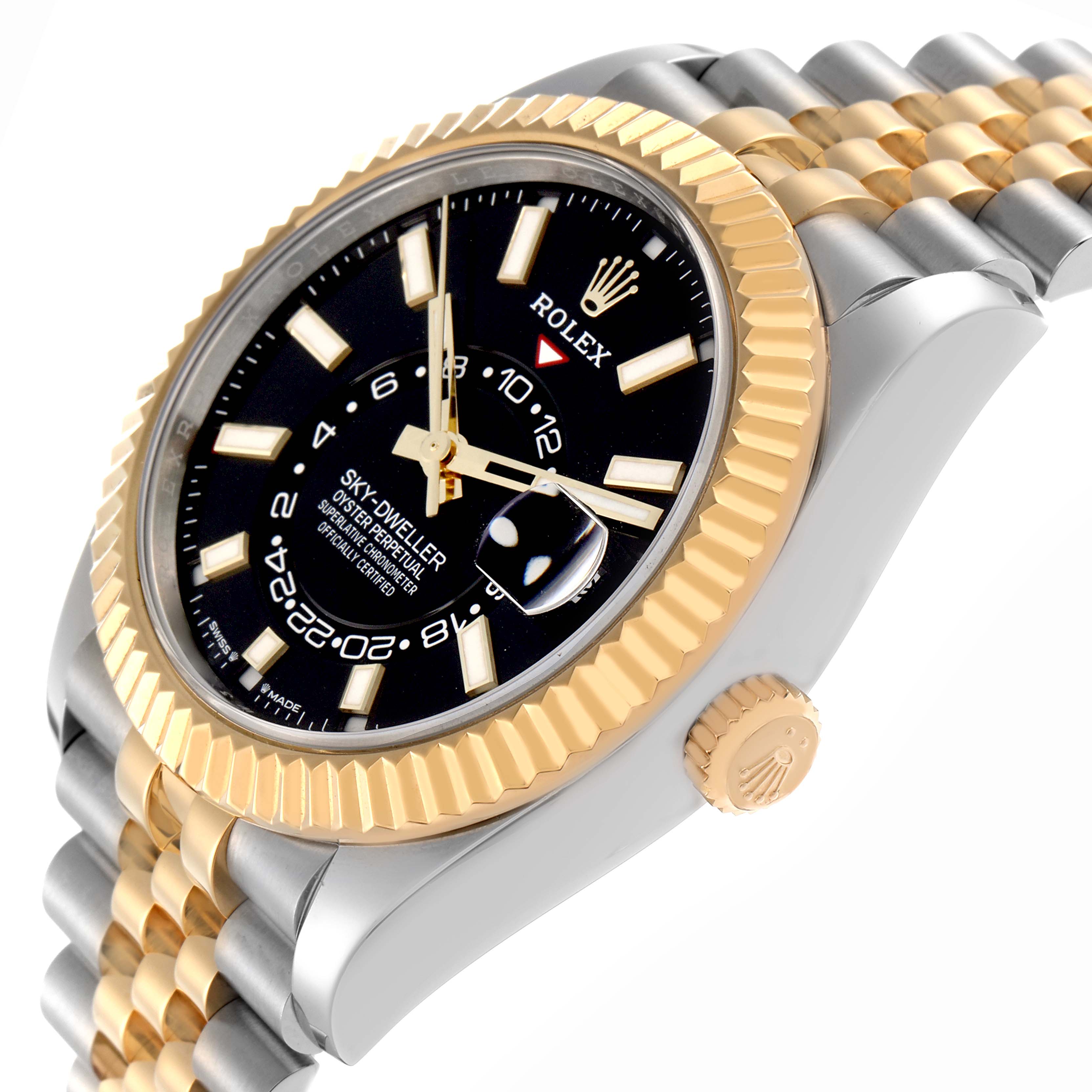 The Rolex Sky-Dweller model 336933 is shown at an angled side view, highlighting its gold fluted bezel, black dial, and two-tone bracelet.