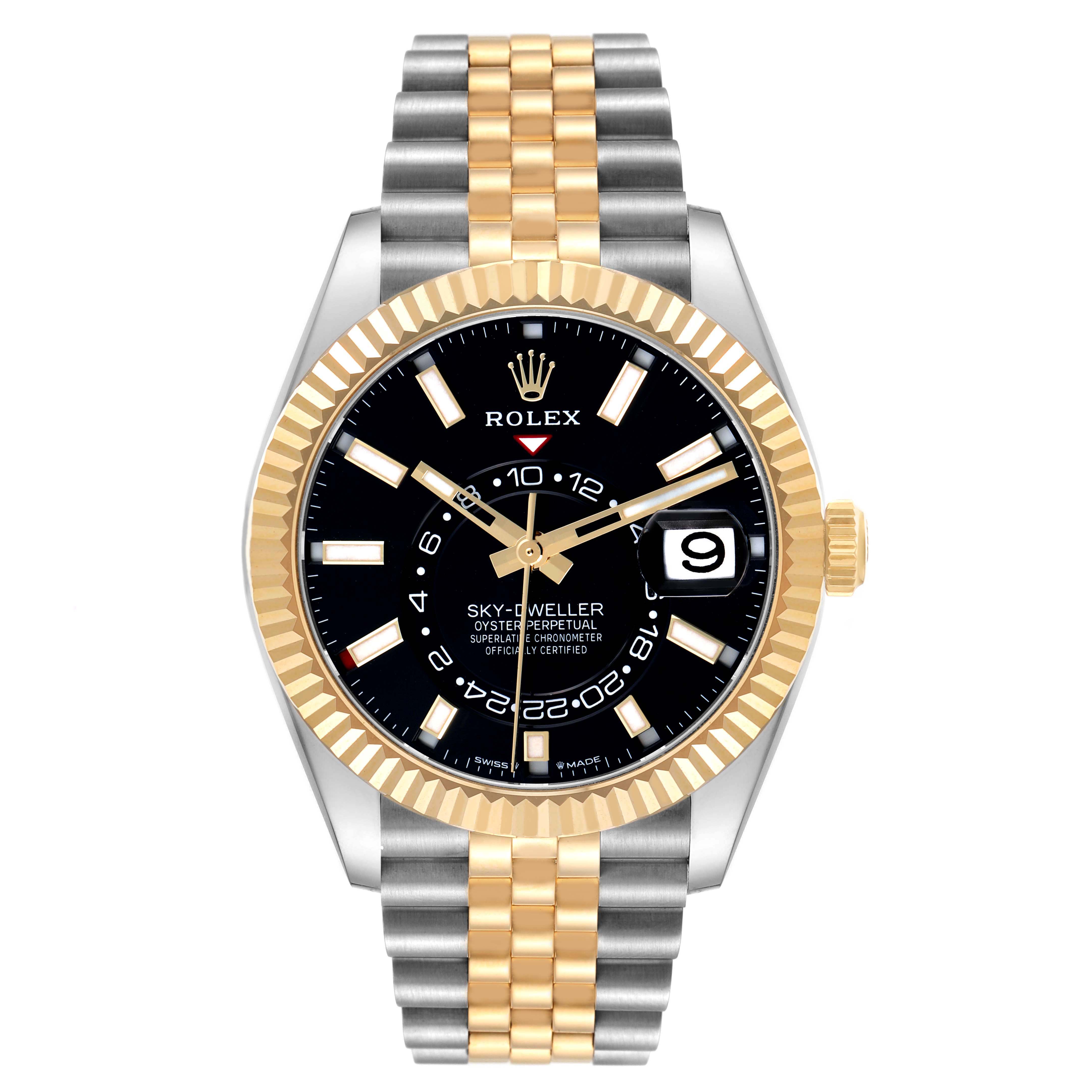 The Rolex Sky-Dweller model 336933 is shown from a frontal angle, displaying its two-tone bracelet, gold fluted bezel, black dial, and date feature.