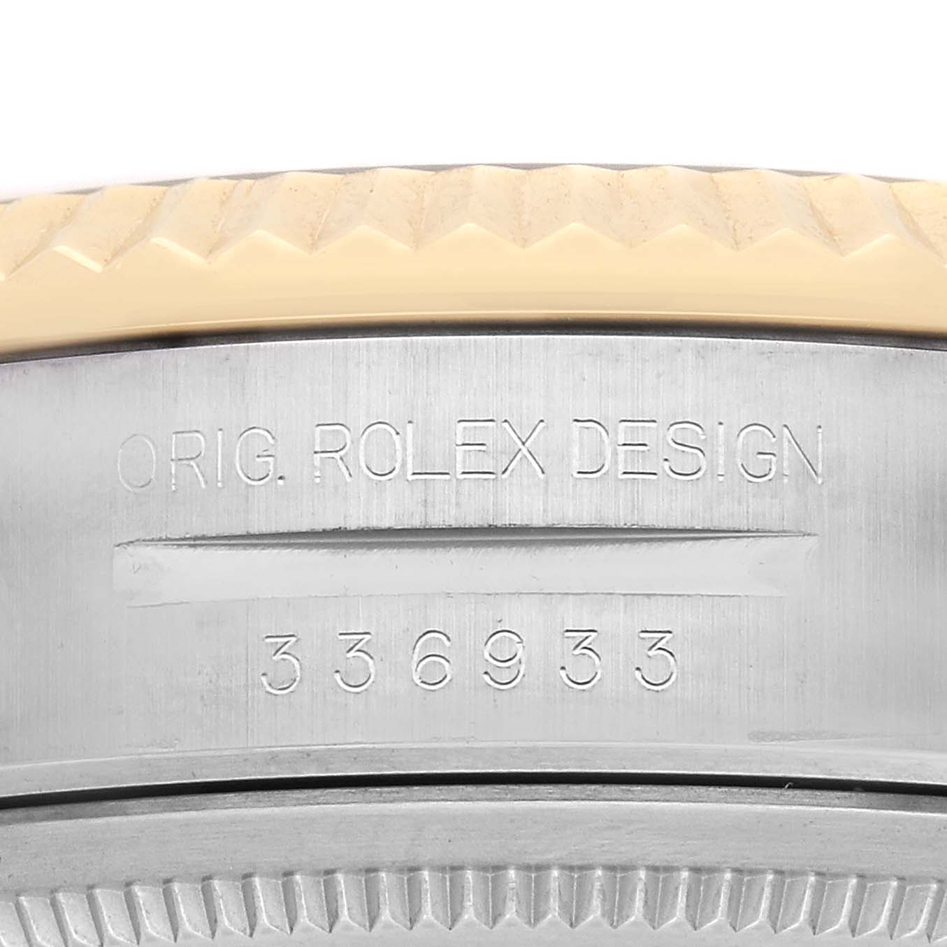 The image shows the side view of a Rolex Sky-Dweller watch, model number 336933, highlighting the engraved design details on the case.