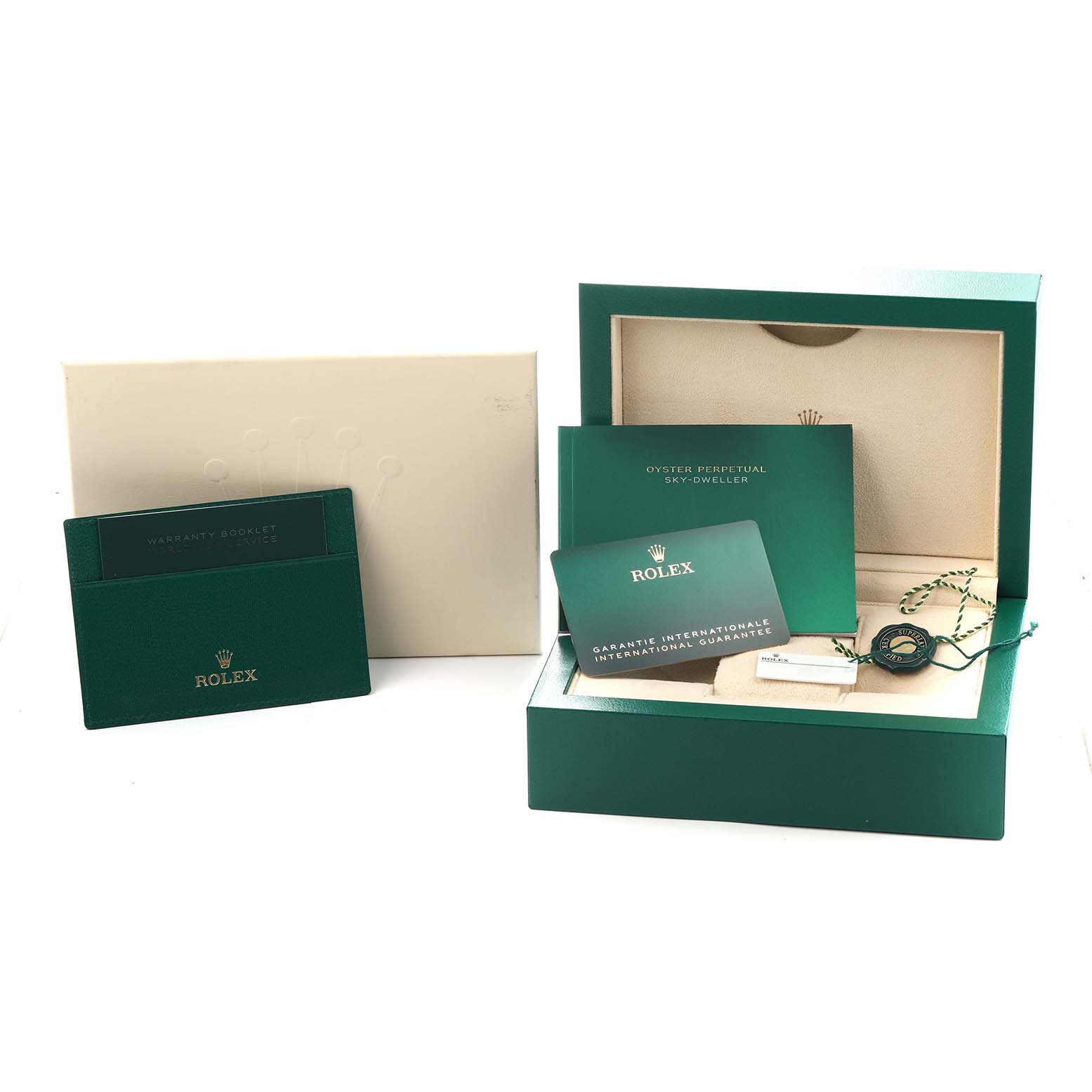 The image shows a Rolex Sky-Dweller model 336933 box with a warranty booklet, international guarantee card, and a tag, all displayed from a front angle.