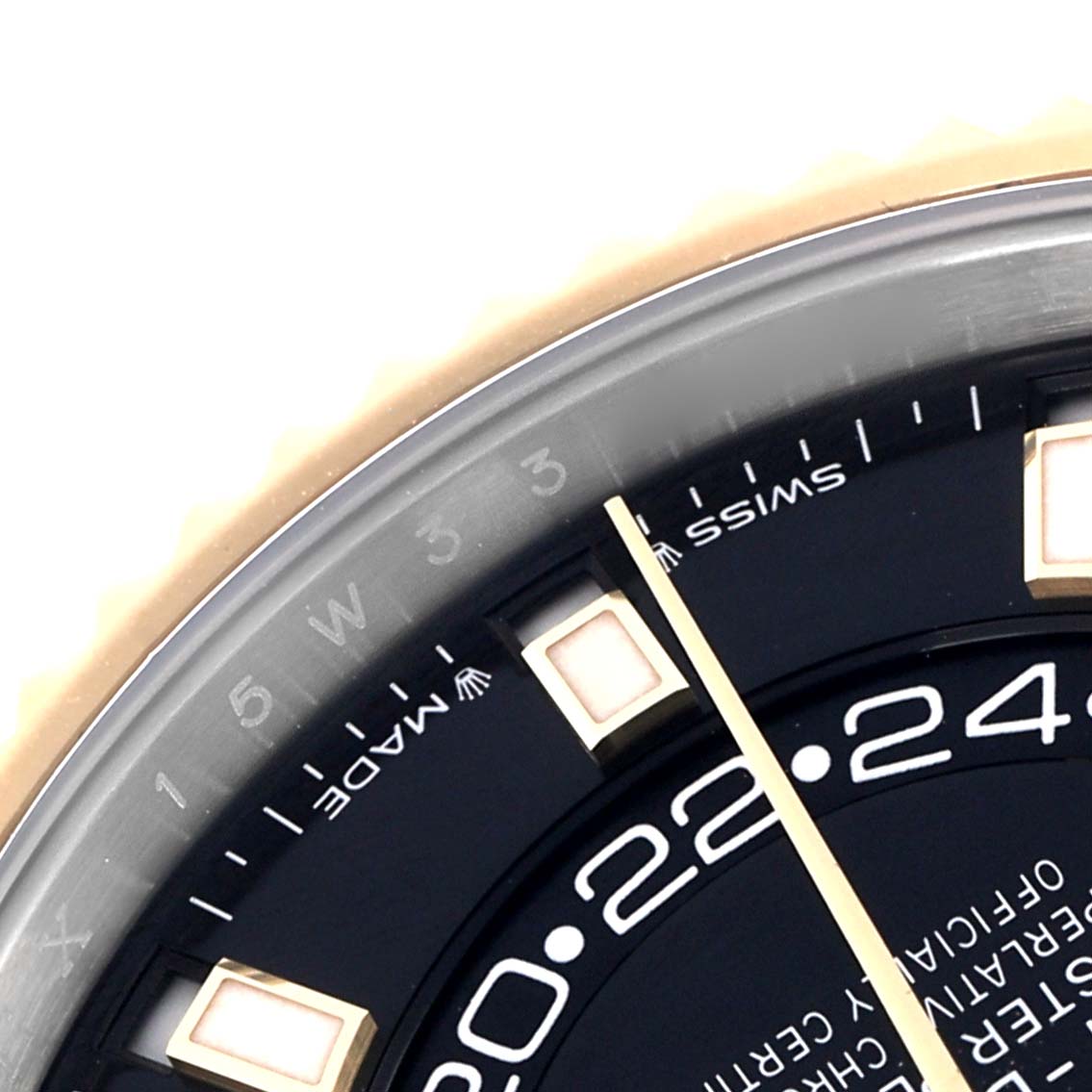 The image shows a close-up of the Rolex Sky-Dweller model 336933, highlighting the dial and hour markers with partial view of the yellow gold fluted bezel.