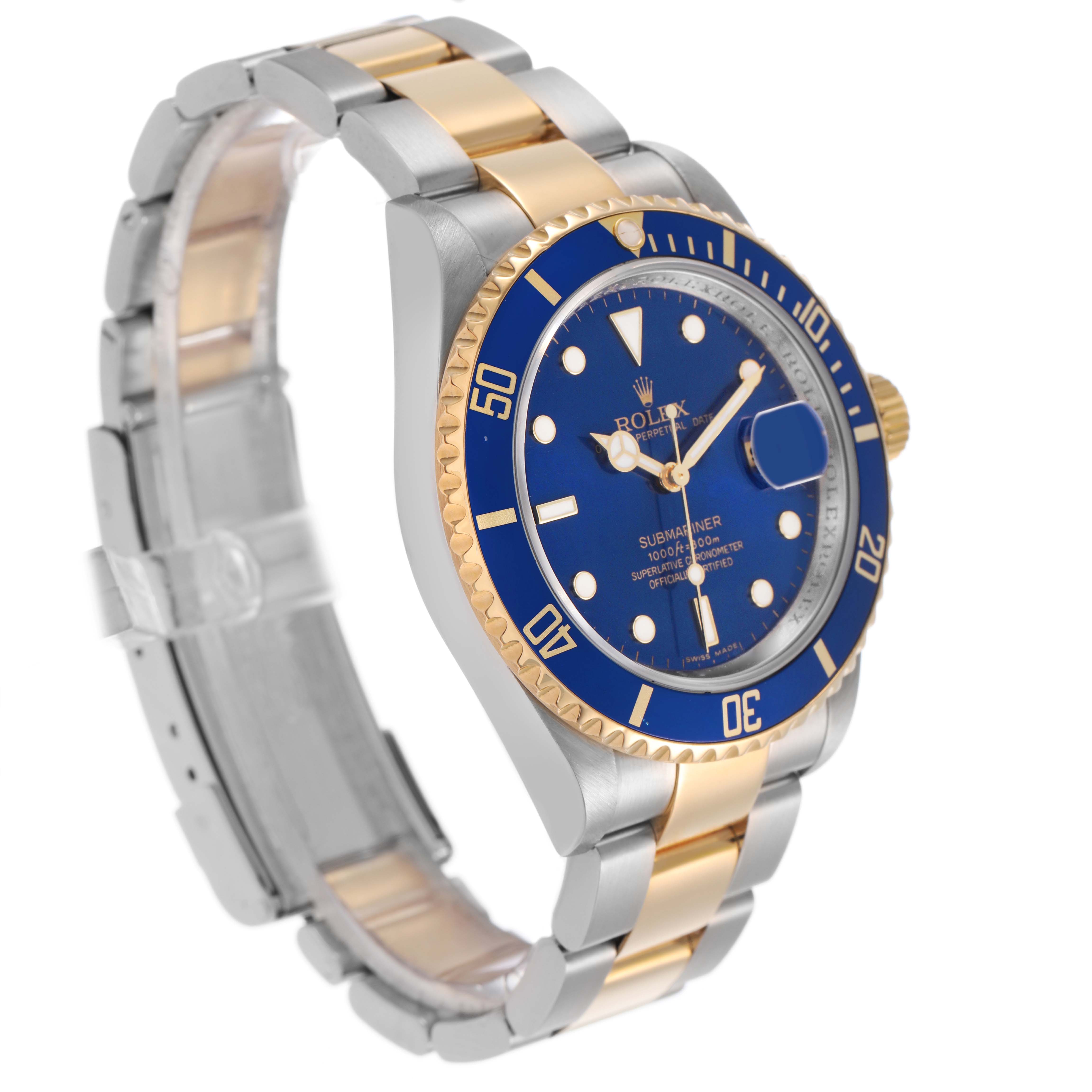 The Rolex Submariner 16613 Men's Steel and Gold (two tone) Blue Dial is shown at a three-quarter angle, highlighting the blue dial, bezel, and two-tone bracelet.