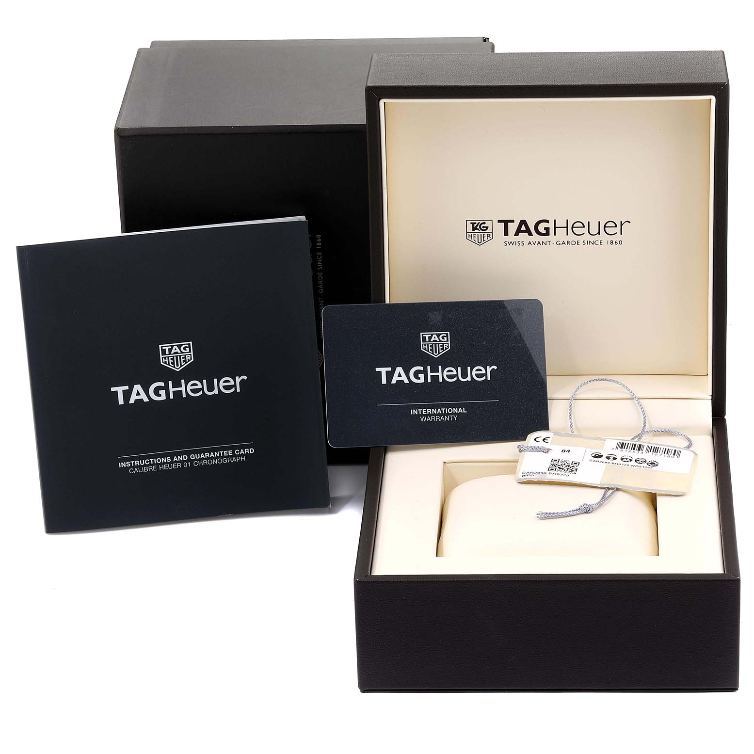 The image shows the packaging, international warranty card, and instruction manual for a Tag Heuer Carrera CAR2090.BH0729 Men's Titanium Black Dial CAR2090.BH0729 Men's Titanium Black Dial watch.