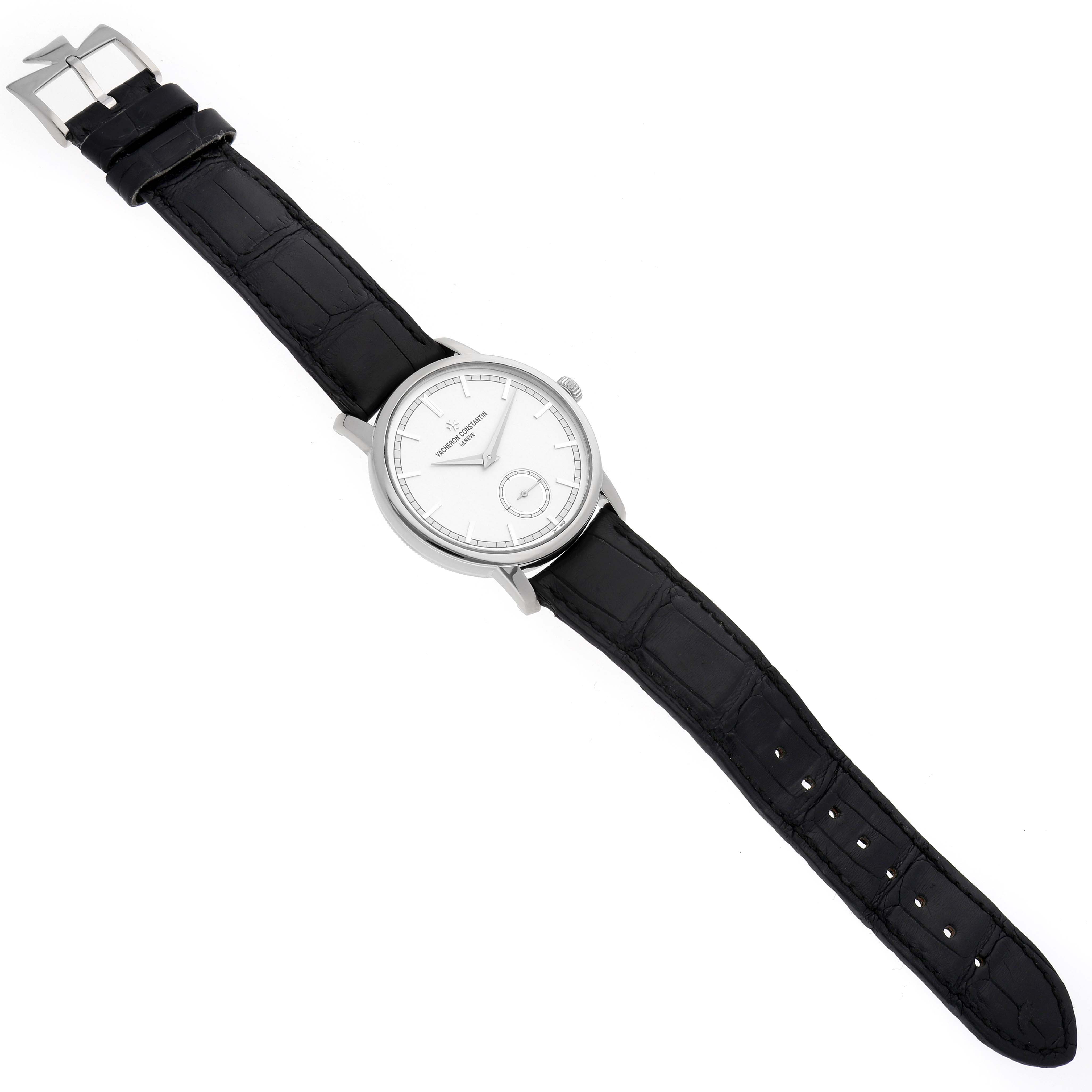 The Vacheron Constantin Traditionnelle 82172/000G Men's White Gold Silver Dial 82172/000G Men's White Gold Silver Dial watch is shown from an overhead angle, displaying its face, case, strap, and buckle.