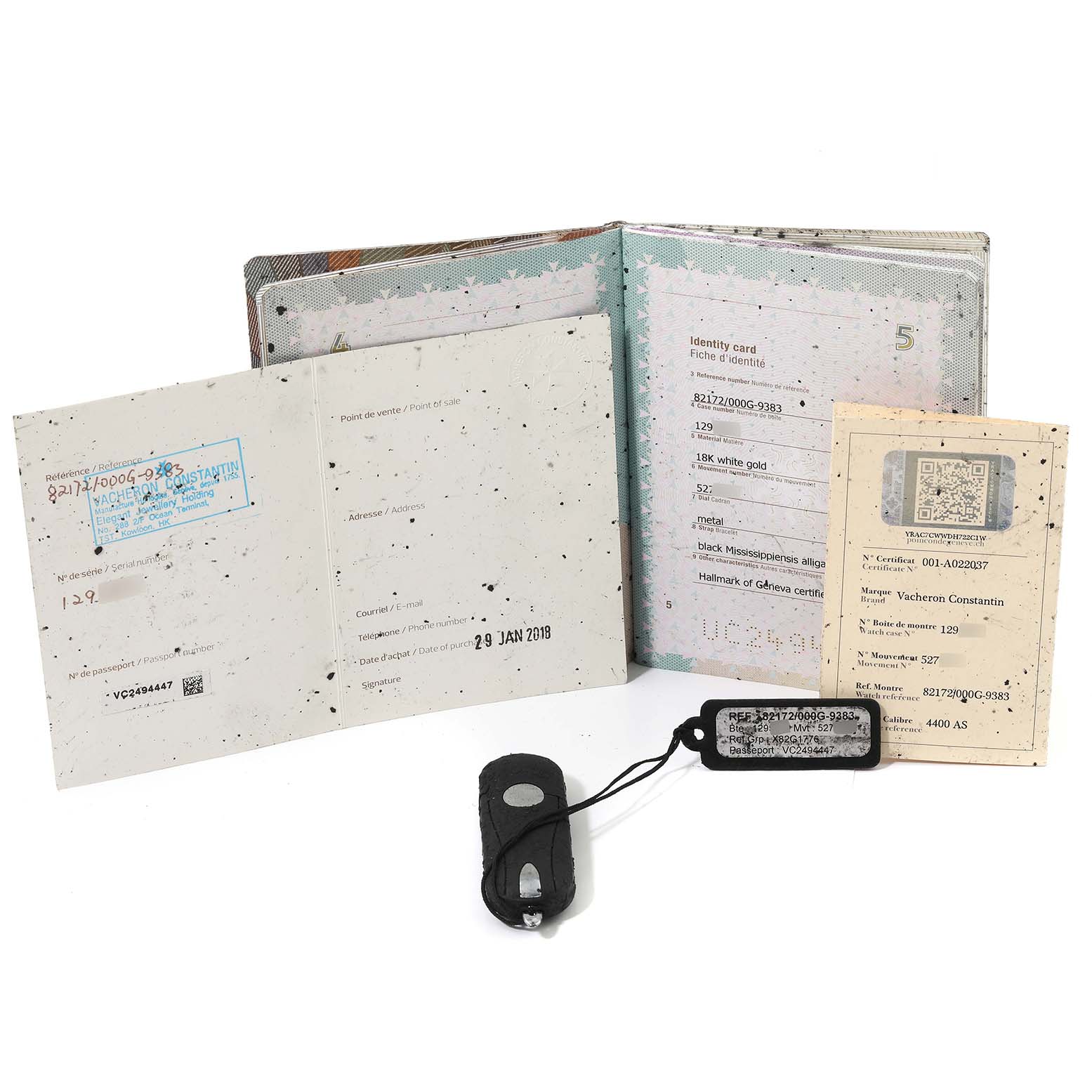 The image shows the documentation and accessories for a Vacheron Constantin Traditionnelle 82172/000G Men's White Gold Silver Dial 82172/000G Men's White Gold Silver Dial watch, including booklets and tags.