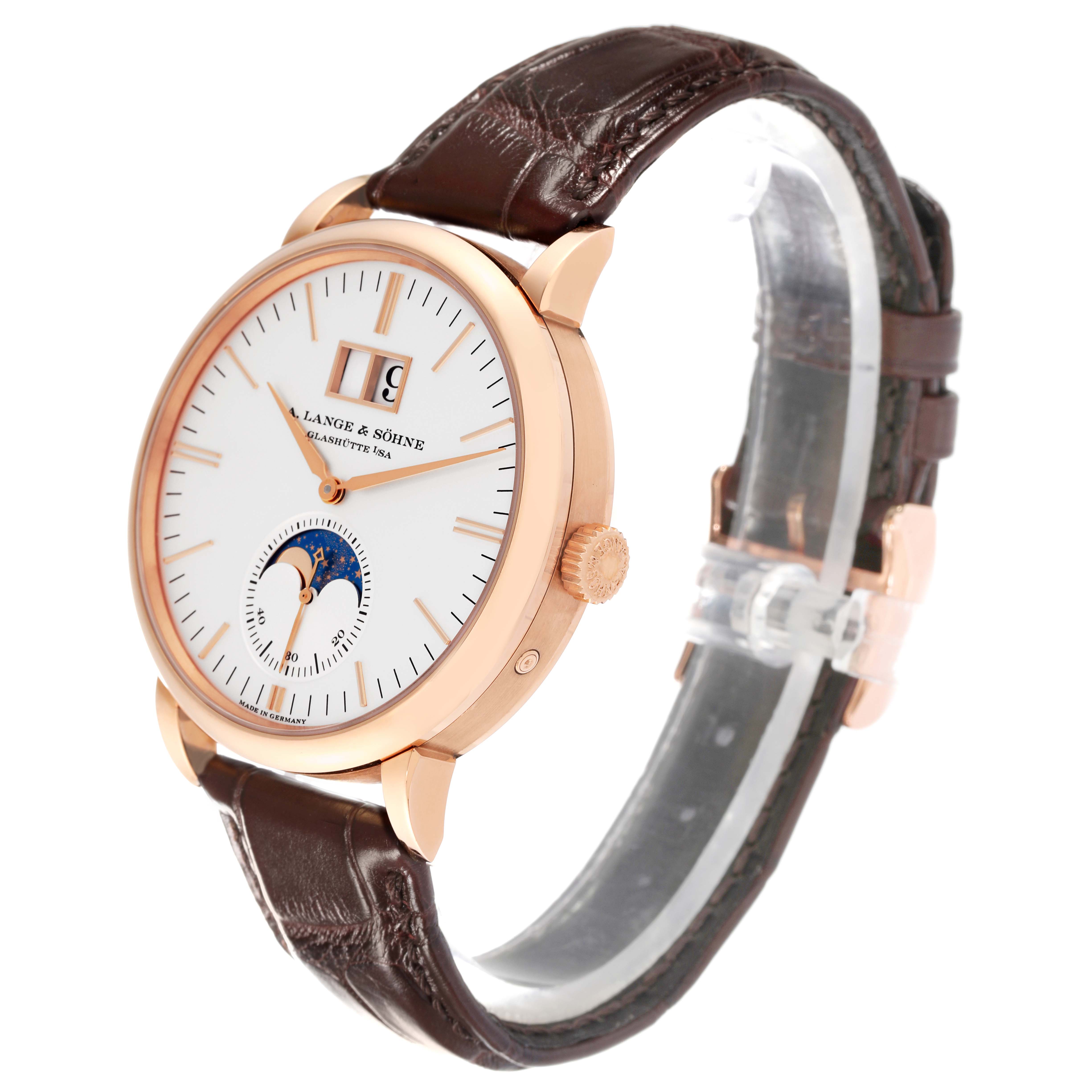 The image shows a side angle of the A. Lange 
Sohne Saxonia 384.032 Men
s Rose Gold Silver Dial watch, highlighting the face, crown, and leather strap.