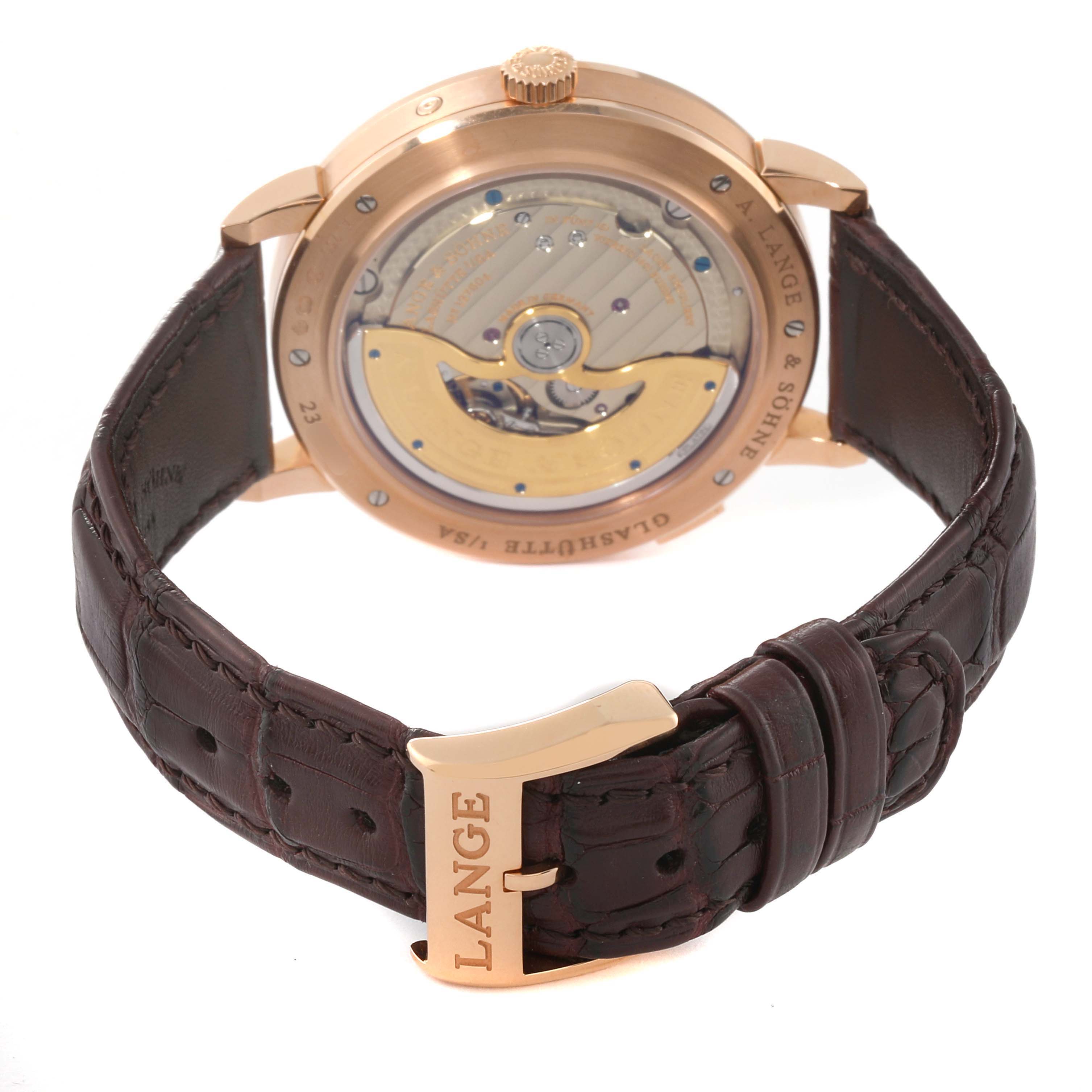 The image shows the back and clasp of the A. Lange 
Sohne Saxonia 384.032 Men
s Rose Gold Silver Dial watch, highlighting the movement and leather strap.