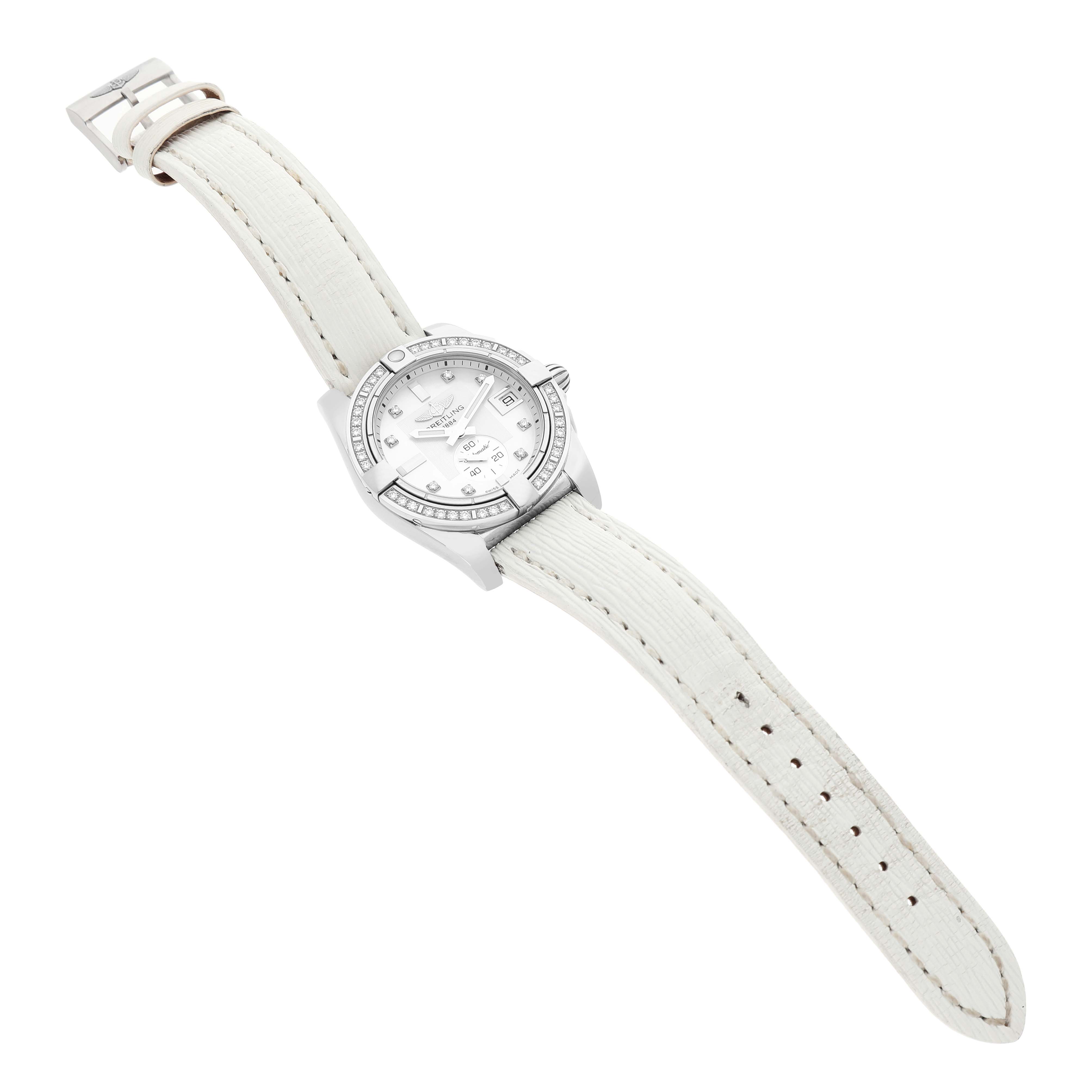 The Breitling Galactic A37330 Men's Stainless Steel Mother of Pearl Dial watch is shown at an angle emphasizing the dial, bezel, and white strap.