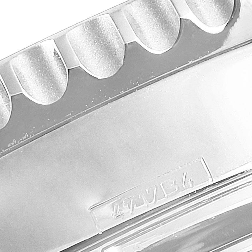 The image shows a close-up of the bezel and part of the case of a Breitling Navitimer AB012721-BD09-453A Men
s Stainless Steel Black Dial AB012721-BD09-453A Men
s Stainless Steel Black Dial watch.