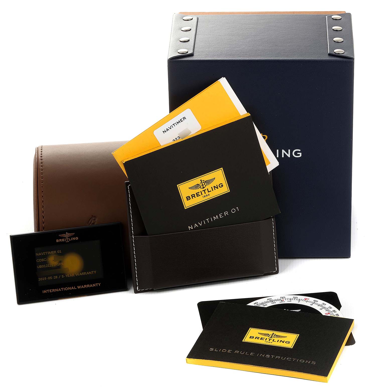 The image shows the packaging, manuals, and warranty card for a Breitling Navitimer UB012121-F582-743P Men's Steel and Gold (two tone) Grey Dial UB012121-F582-743P Men's Steel and Gold (two tone) Grey Dial watch.