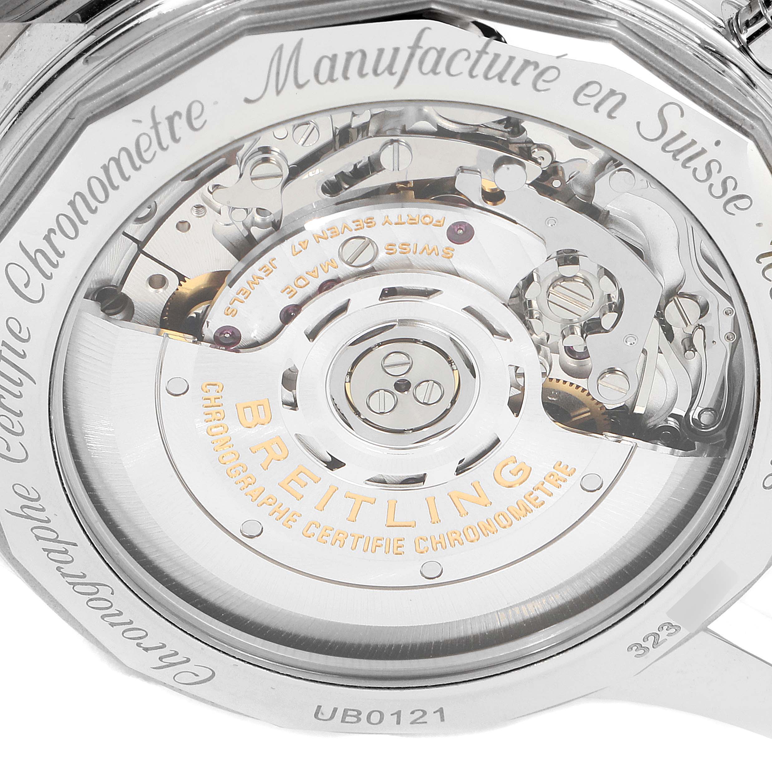 The image shows the back view of the Breitling Navitimer UB012121-F582-743P Men's Steel and Gold (two tone) Grey Dial UB012121-F582-743P Men's Steel and Gold (two tone) Grey Dial watch, highlighting its intricate mechanism and engravings.