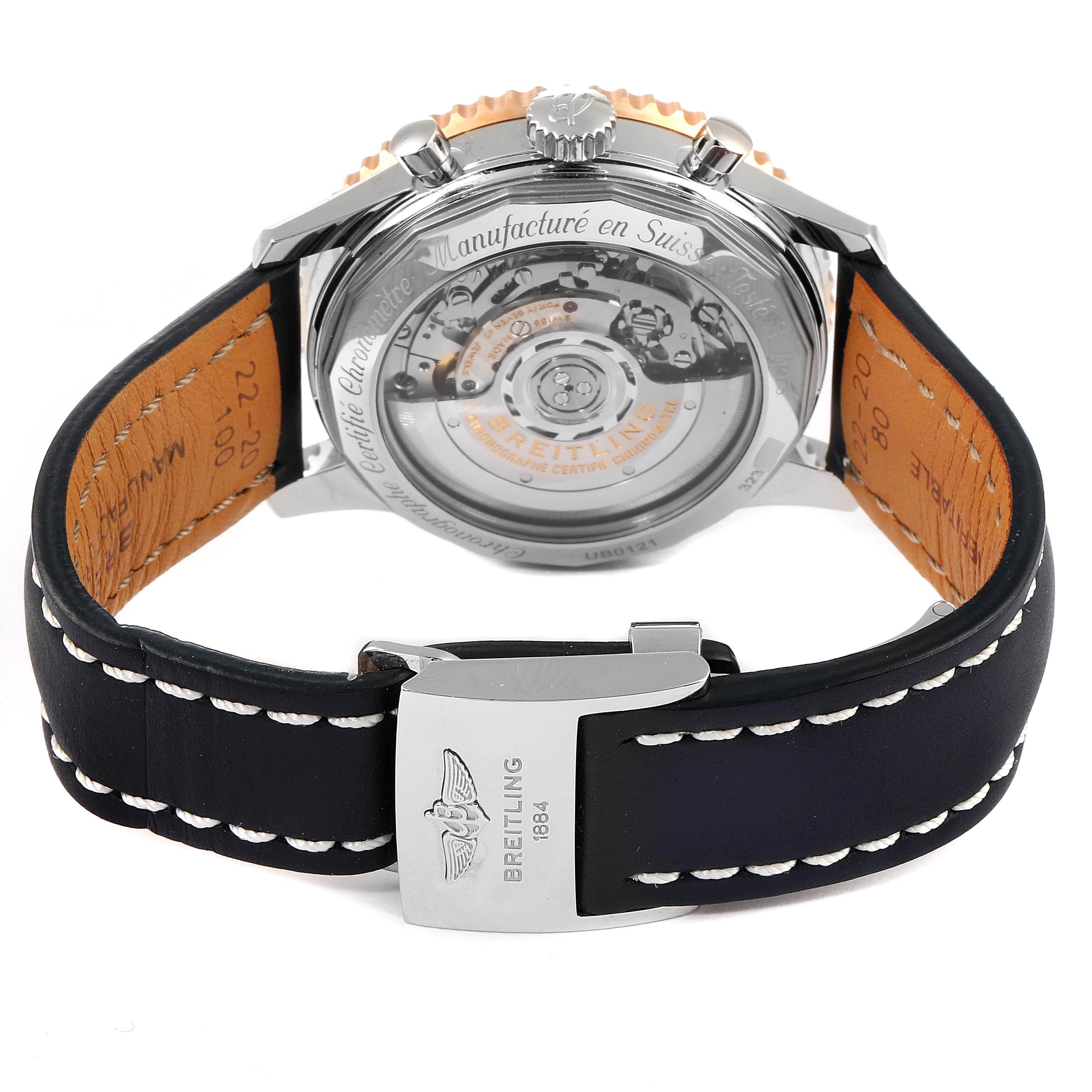 The image shows the back case and strap of a Breitling Navitimer UB012121-F582-743P Men's Steel and Gold (two tone) Grey Dial UB012121-F582-743P Men's Steel and Gold (two tone) Grey Dial watch, highlighting its transparent case back and leather strap.