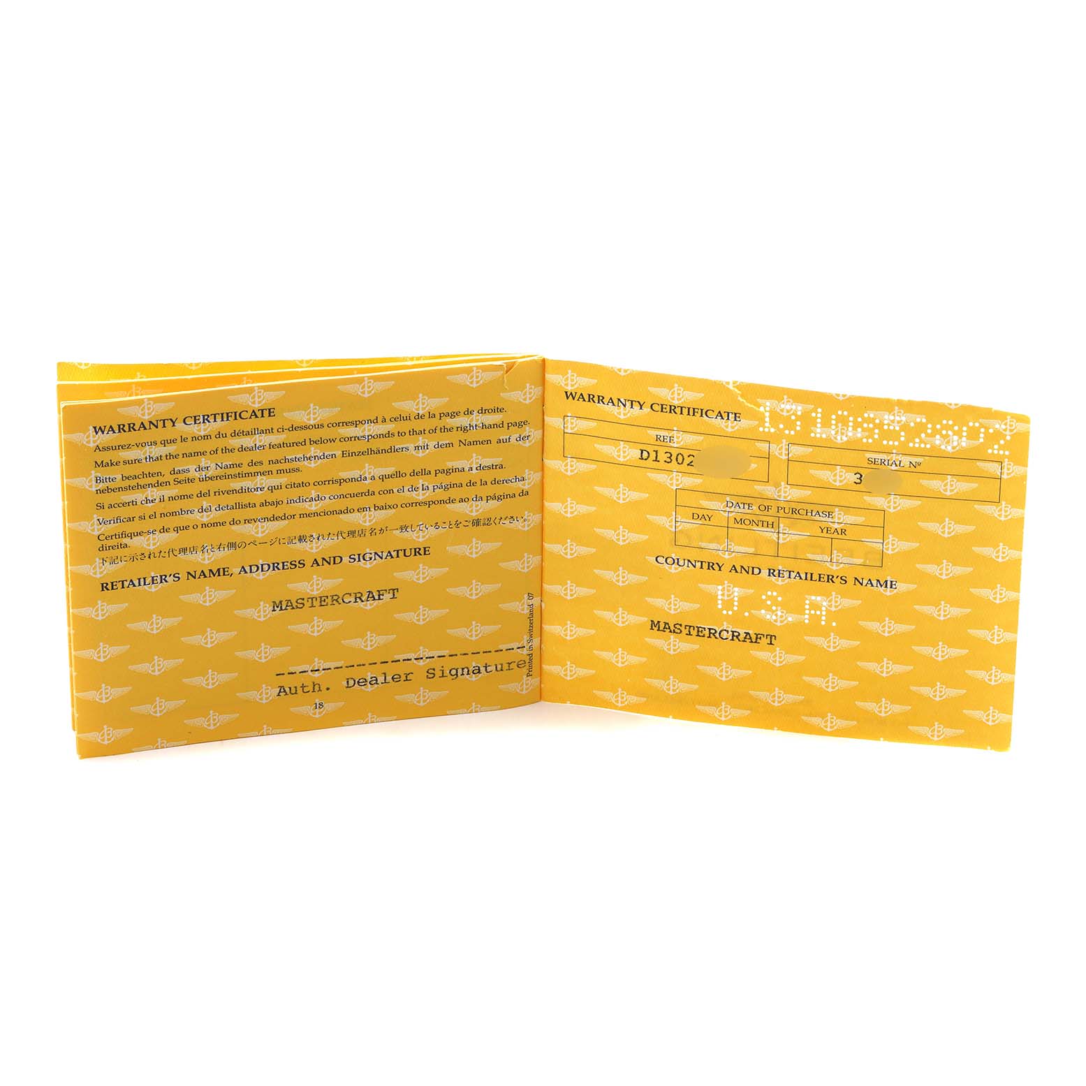 The image shows a warranty certificate booklet for the Breitling Navitimer D13022 Men
s Steel and Gold (two tone) Black Dial watch, open to display text and blank fields.