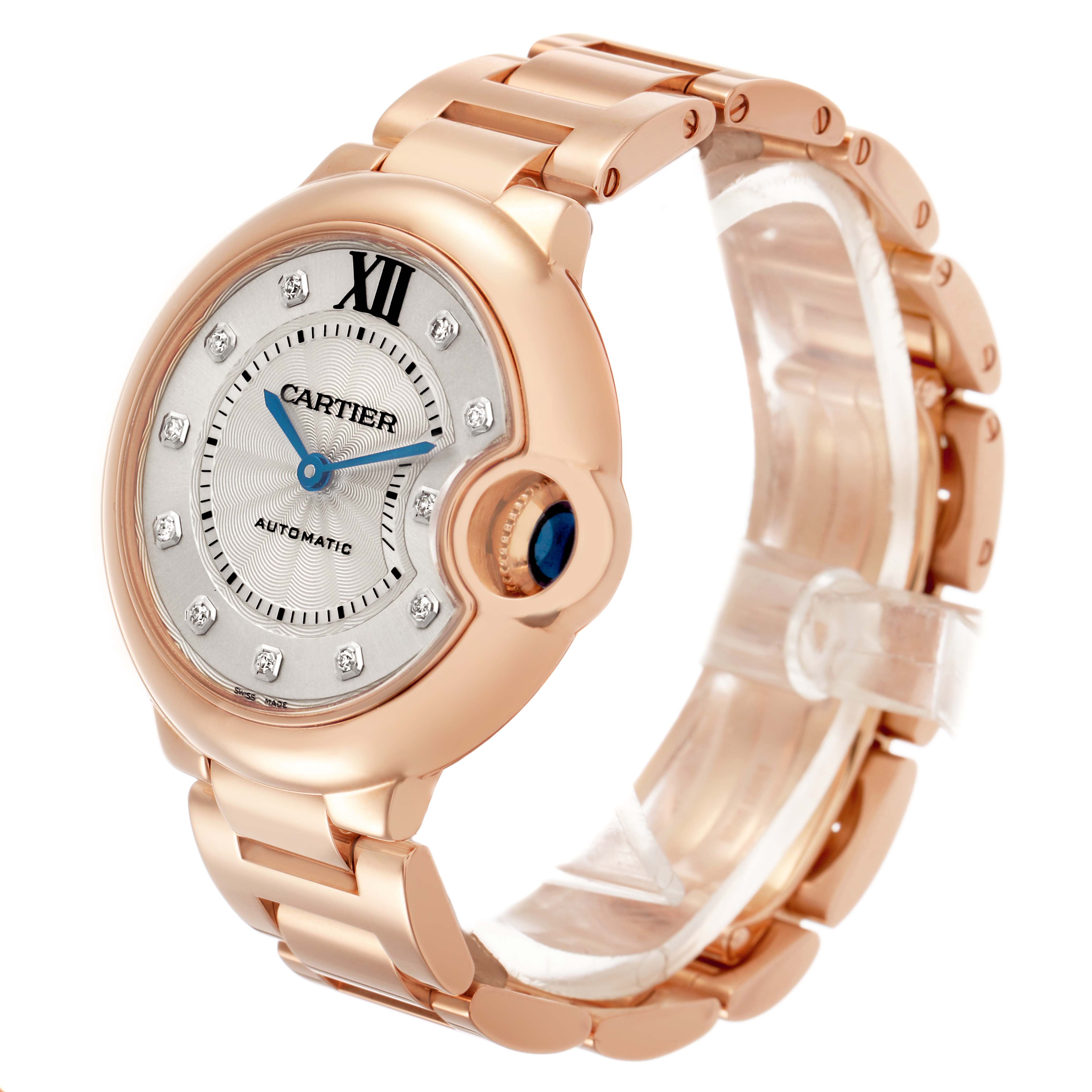 The Cartier Ballon Bleu WE902039 Women's Rose Gold Silver Dial watch is shown at a three-quarter angle, highlighting the face, crown, and bracelet.
