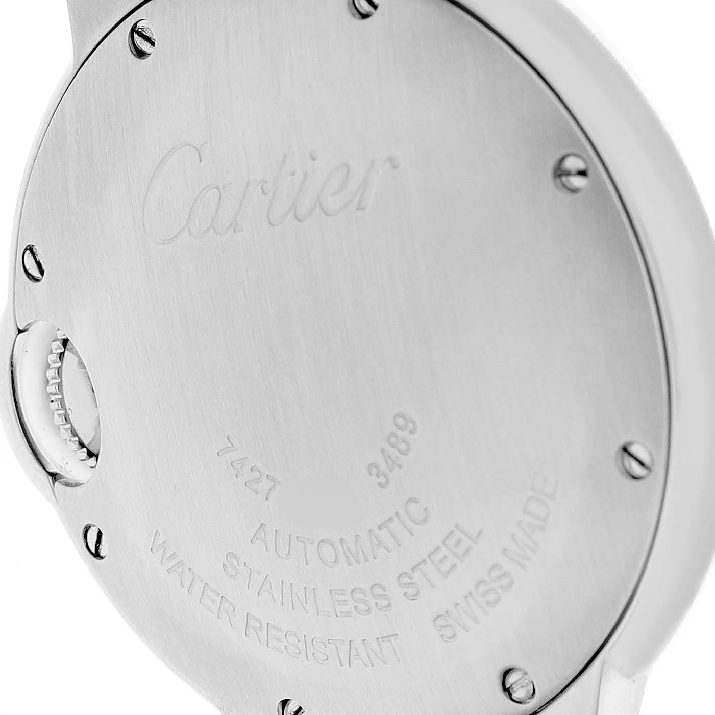 The image shows the back case of a Cartier Ballon Bleu W4BB0016 Women's Stainless Steel Silver Dial watch, highlighting its engravings and screws.
