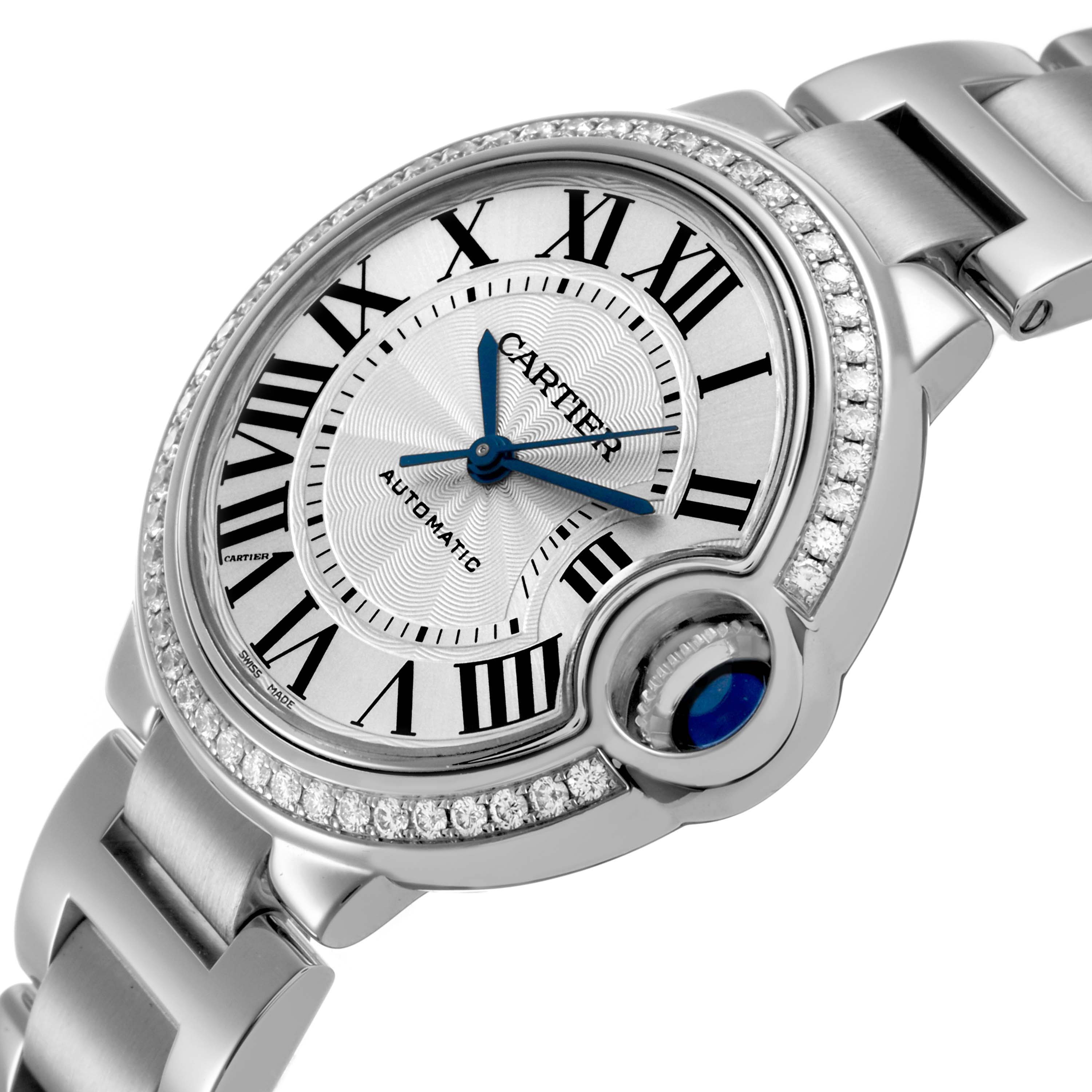 The image shows a close-up of the Cartier Ballon Bleu W4BB0016 Women's Stainless Steel Silver Dial watch at an angle highlighting its face, crown, and bracelet.