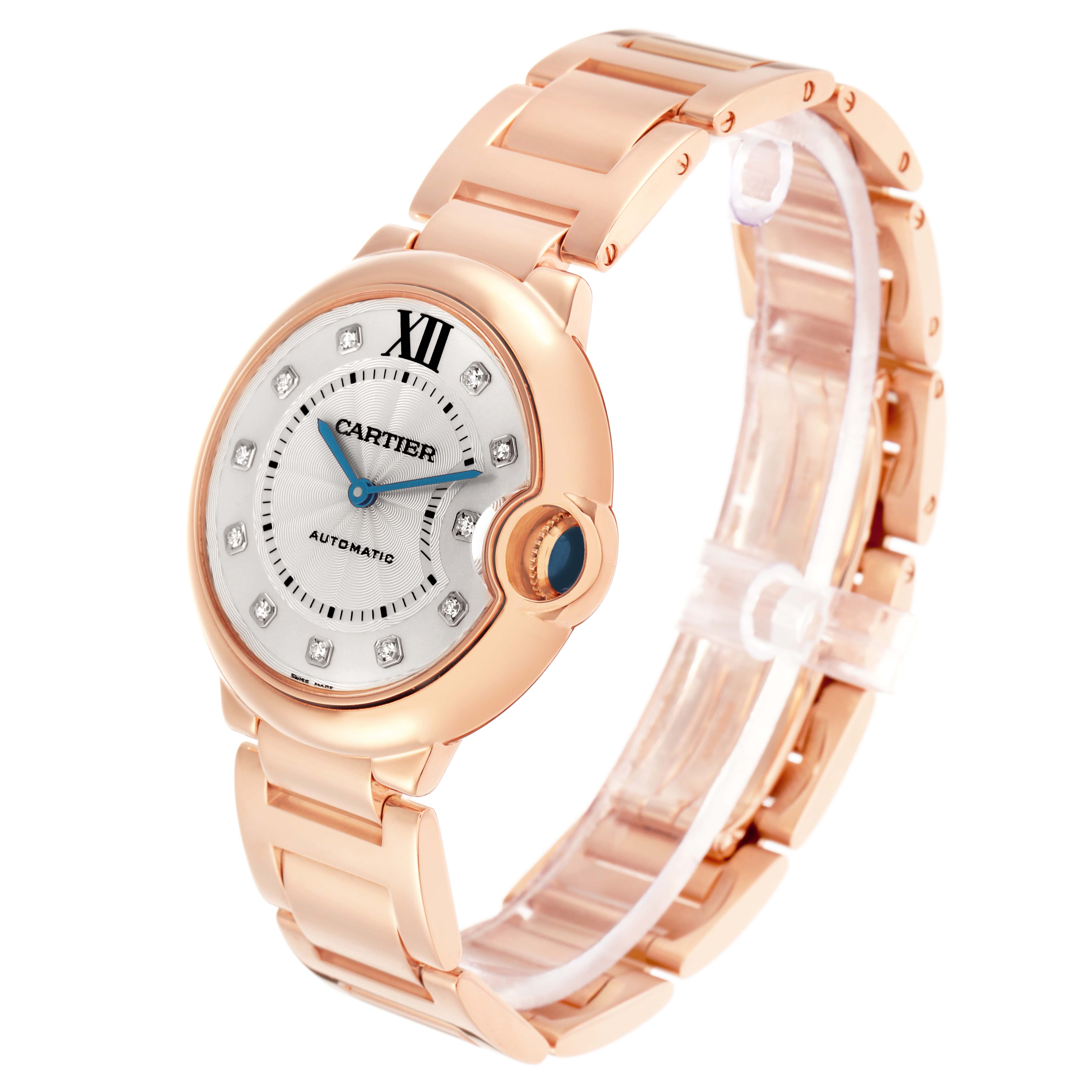 The image shows a Cartier Ballon Bleu WE902026 Women
s Rose Gold Silver Dial watch at a three-quarter angle, highlighting the face, bezel, and bracelet.