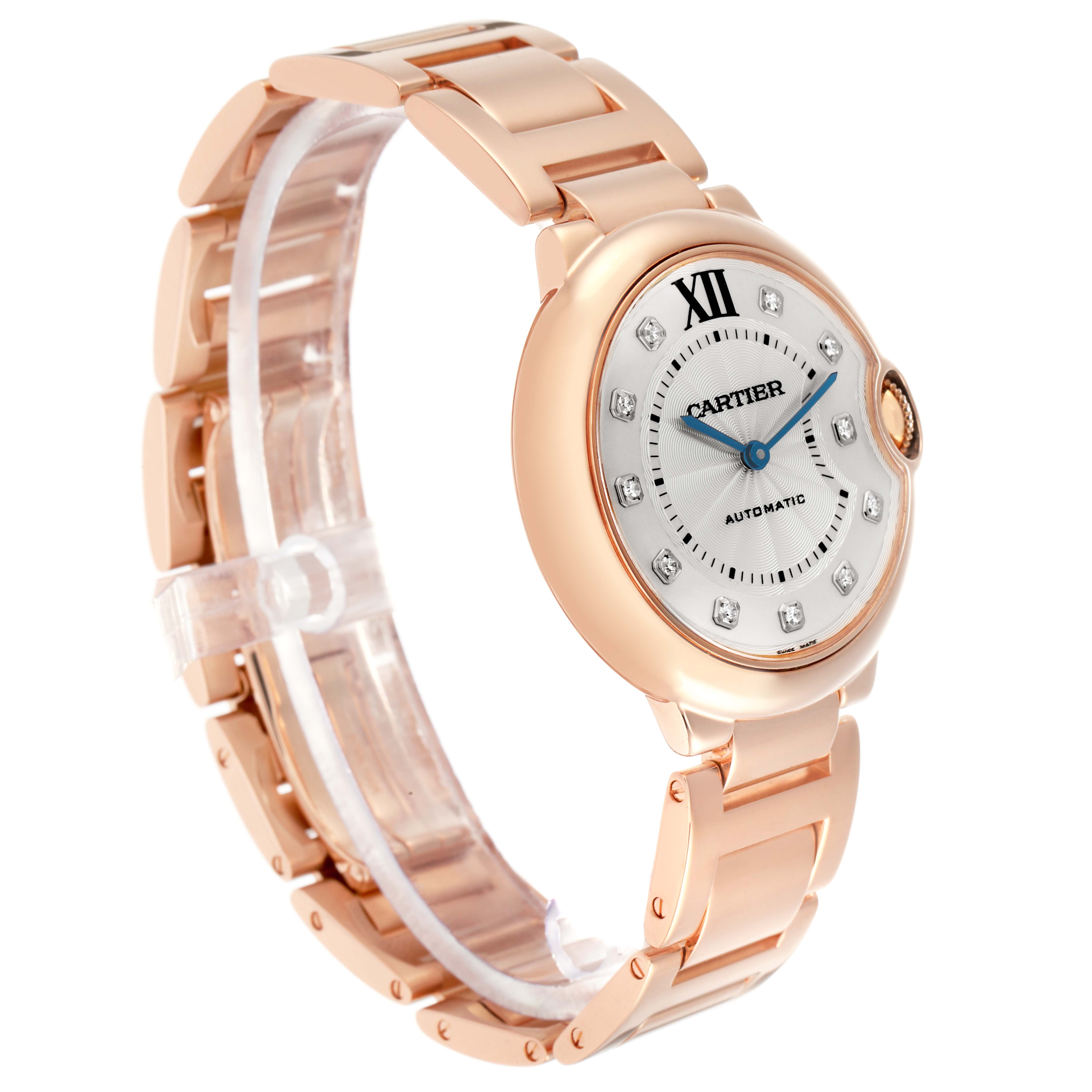The Cartier Ballon Bleu WE902026 Women
s Rose Gold Silver Dial watch is shown at a side angle, highlighting its face, bracelet, and crown.