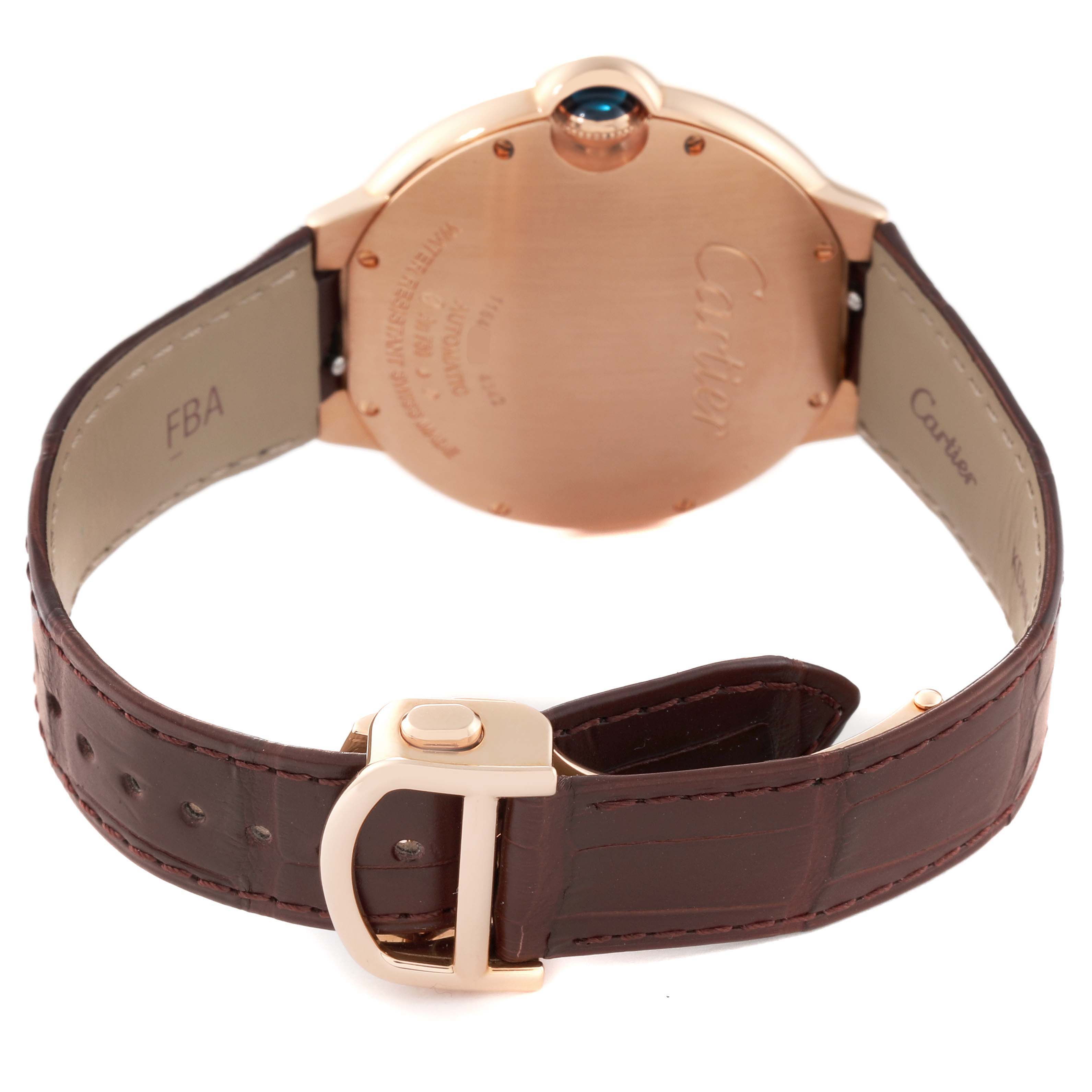 The image shows the back of a Cartier Ballon Bleu WGBB0035 Men's Rose Gold Silver Dial WGBB0035 Men's Rose Gold Silver Dial watch, including its case, crown, and brown leather strap with a deployant clasp.