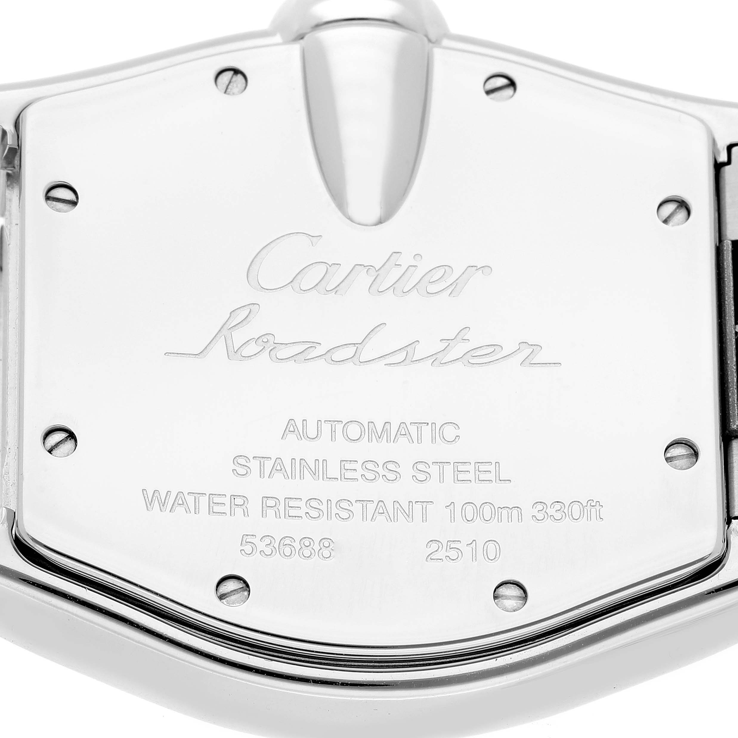 This image shows the back case of a Cartier Roadster W62041V3 Men's Stainless Steel Black Dial W62041V3 Men's Stainless Steel Black Dial watch, displaying engravings and screws.