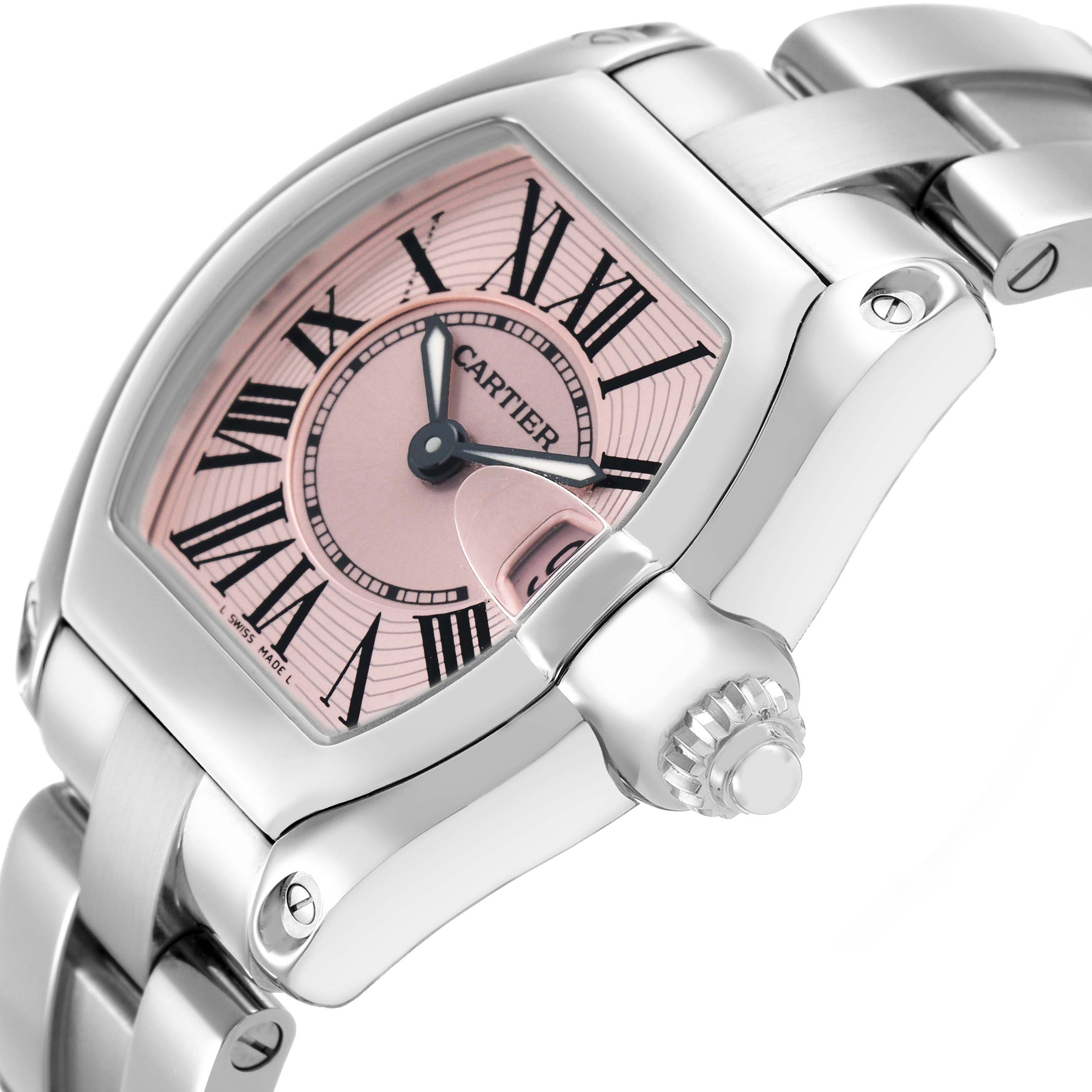 The Cartier Roadster W62017V3 Women's Stainless Steel Pink Dial watch is shown at an angle highlighting the side profile, crown, and bracelet, with a pink dial and Roman numerals.