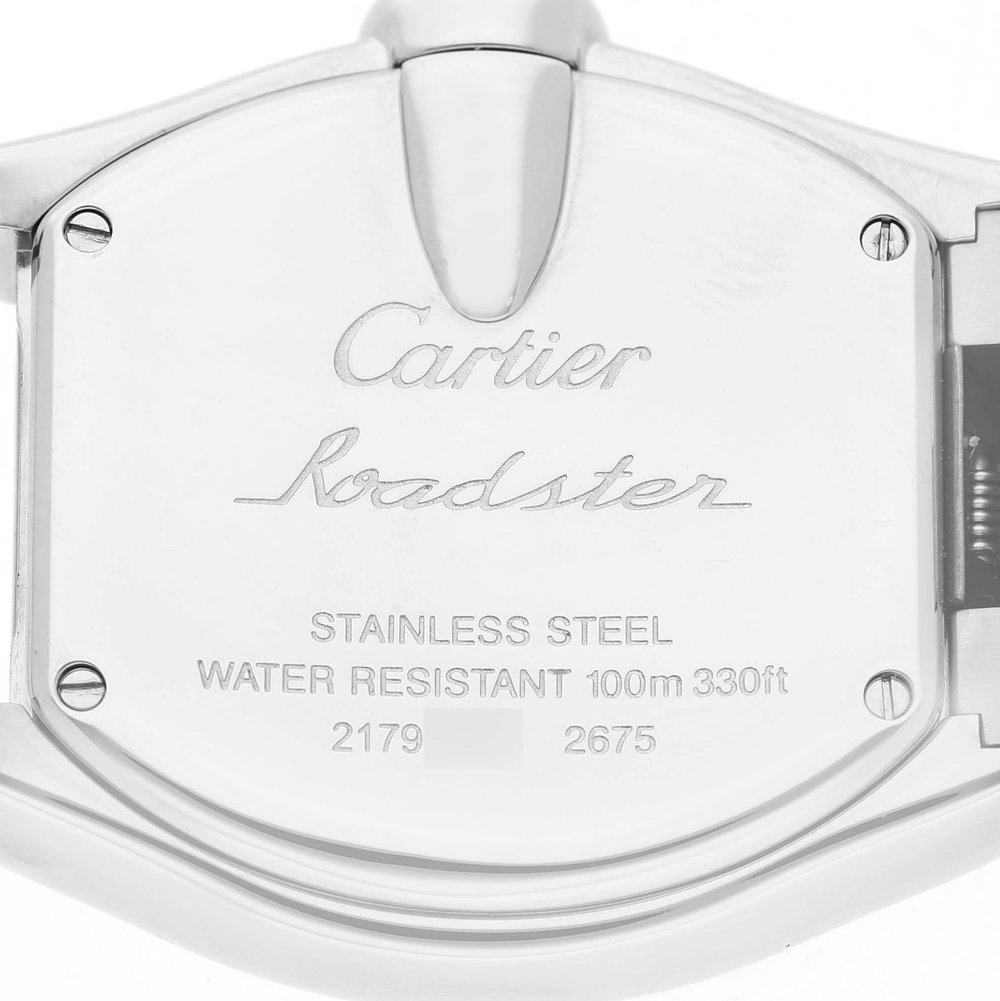 The image shows the back of the Cartier Roadster W62017V3 Women's Stainless Steel Pink Dial watch, featuring its branding and specifications.