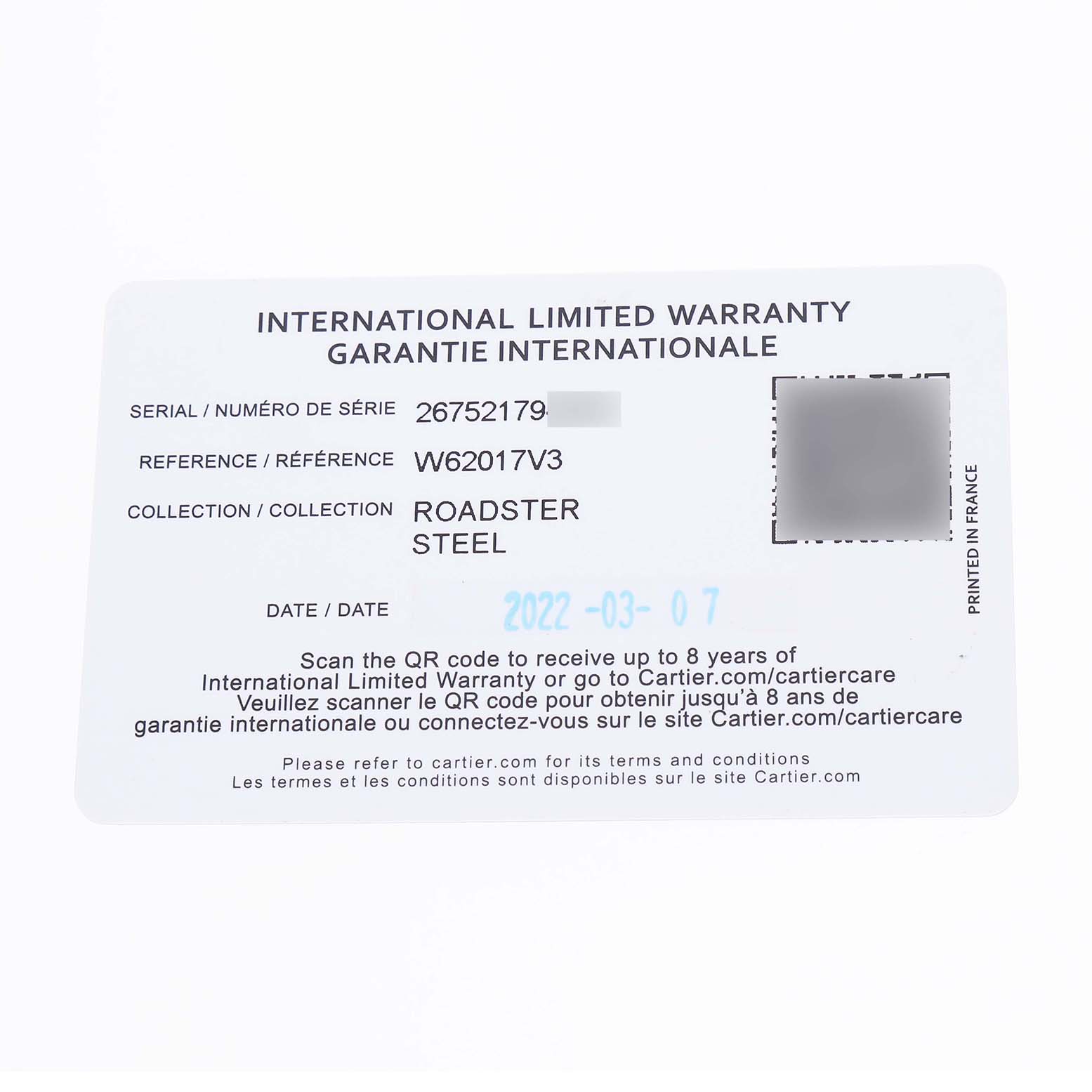The image shows an International Limited Warranty card for a Cartier Roadster W62017V3 Women's Stainless Steel Pink Dial watch, detailing serial and reference numbers.