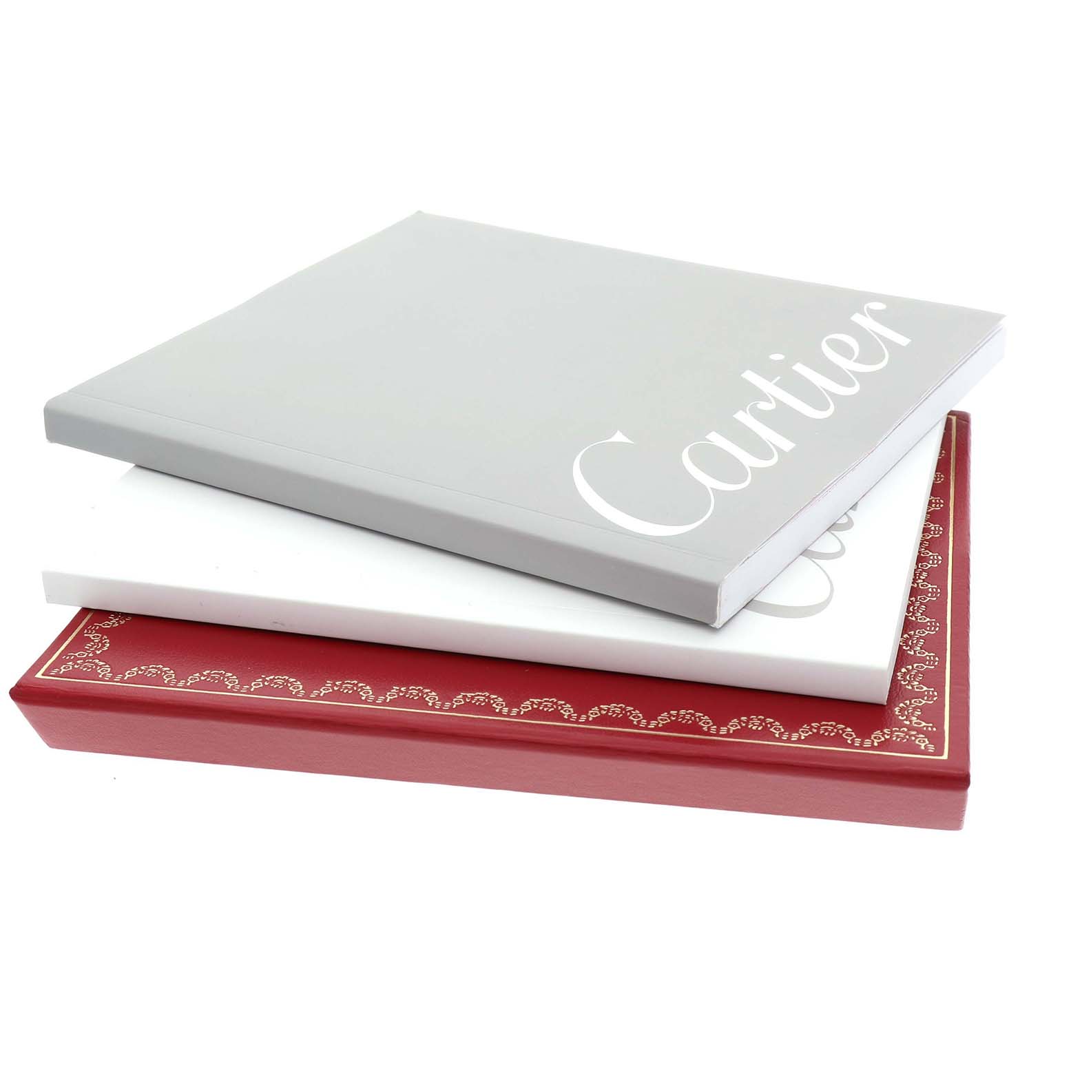 The image shows Cartier Roadster W62031Y4 Men's Stainless Steel Silver Dial watch manuals and packaging at an angle, stacked facing left.