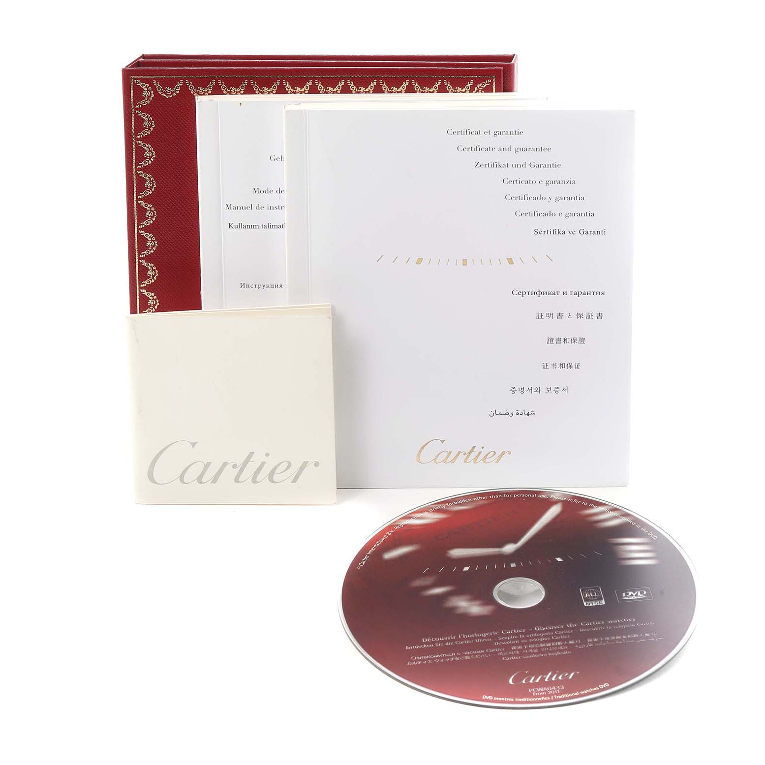 The image shows the Cartier Tank Louis W1529856 Women
s Yellow Gold Silver Dial model box set including manuals, certificate, and a DVD, viewed from the front.