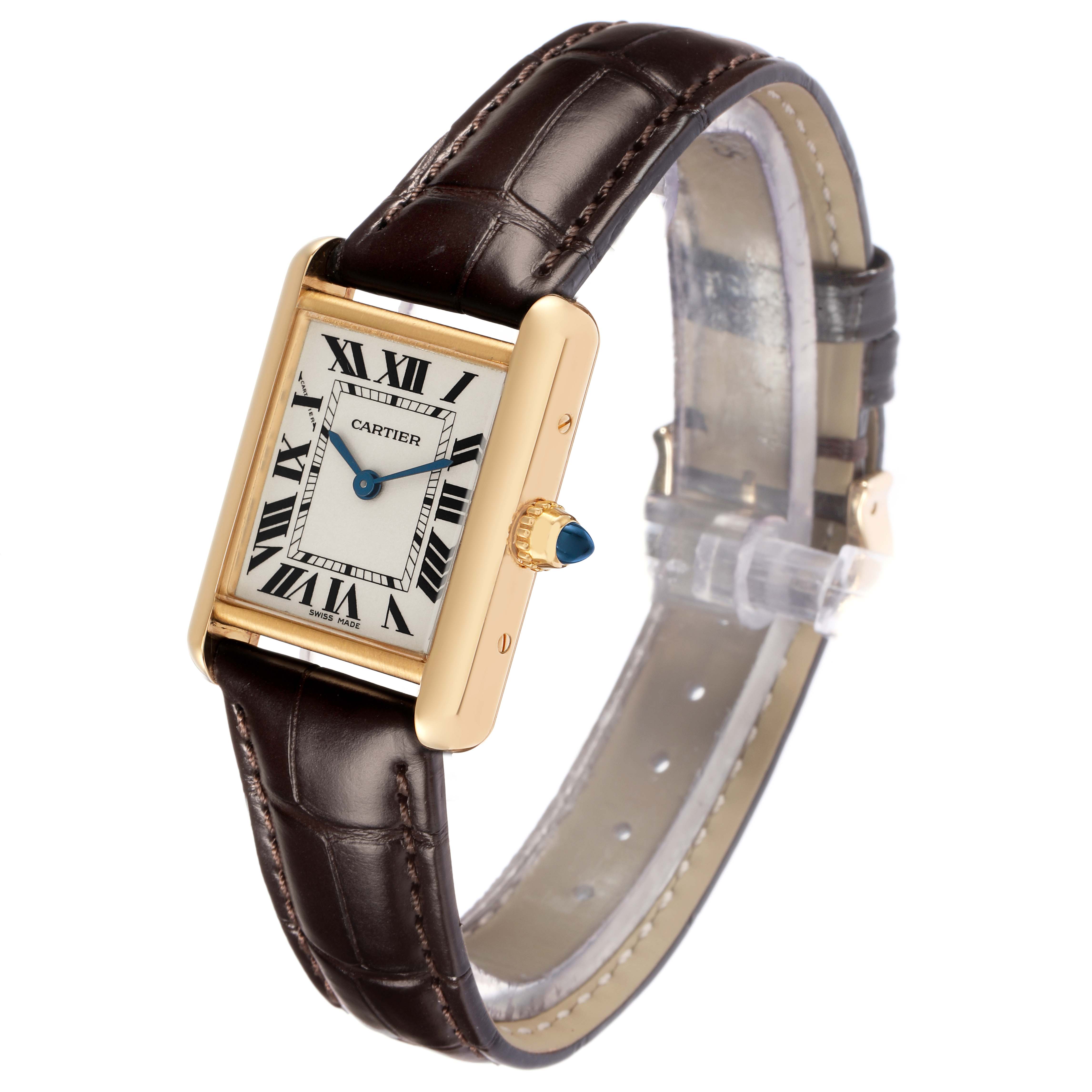 The Cartier Tank Louis W1529856 Women
s Yellow Gold Silver Dial watch is shown at a side angle, displaying the face, gold casing, crown, and leather strap.