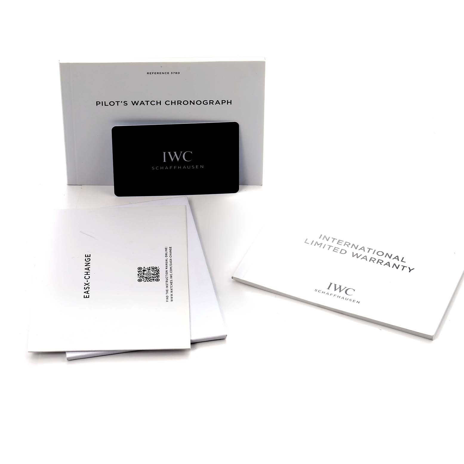 The image shows the IWC Pilot IW378004 Men
s Stainless Steel Blue Dial
s Watch model accessories, including manuals and a warranty card, laid out flat.