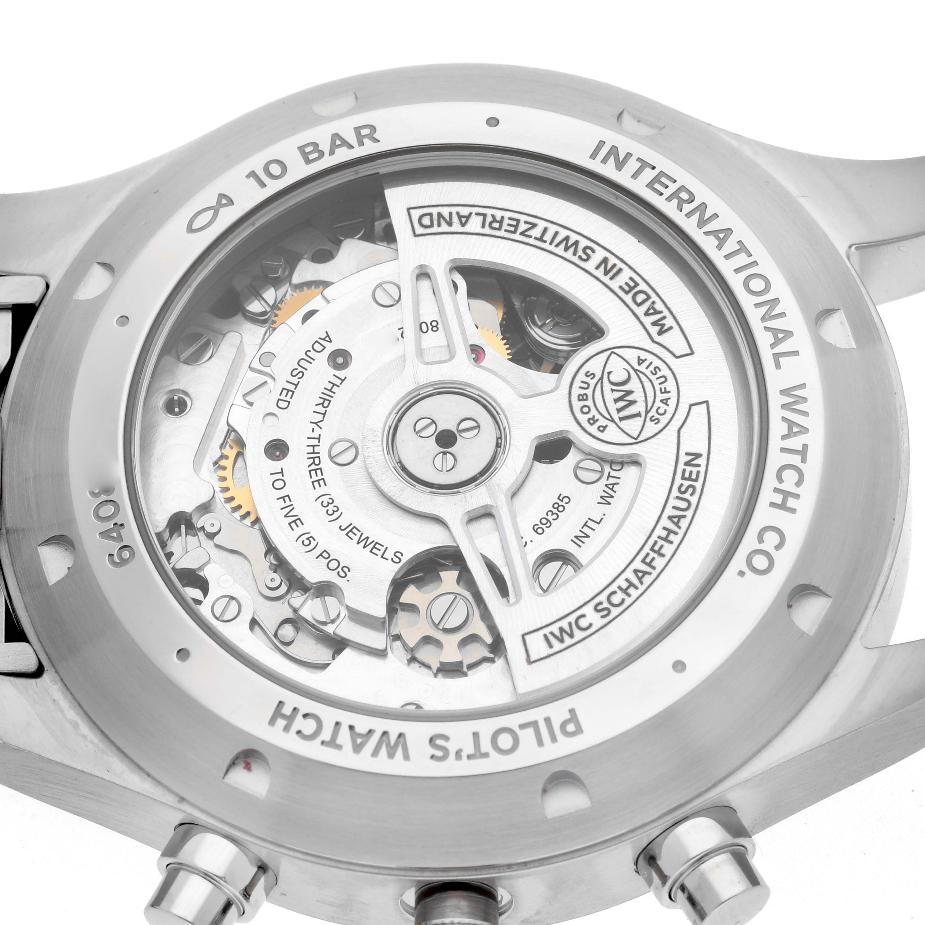 The image shows the case back of an IWC Pilot IW378004 Men
s Stainless Steel Blue Dial model watch, revealing its intricate mechanical movement.