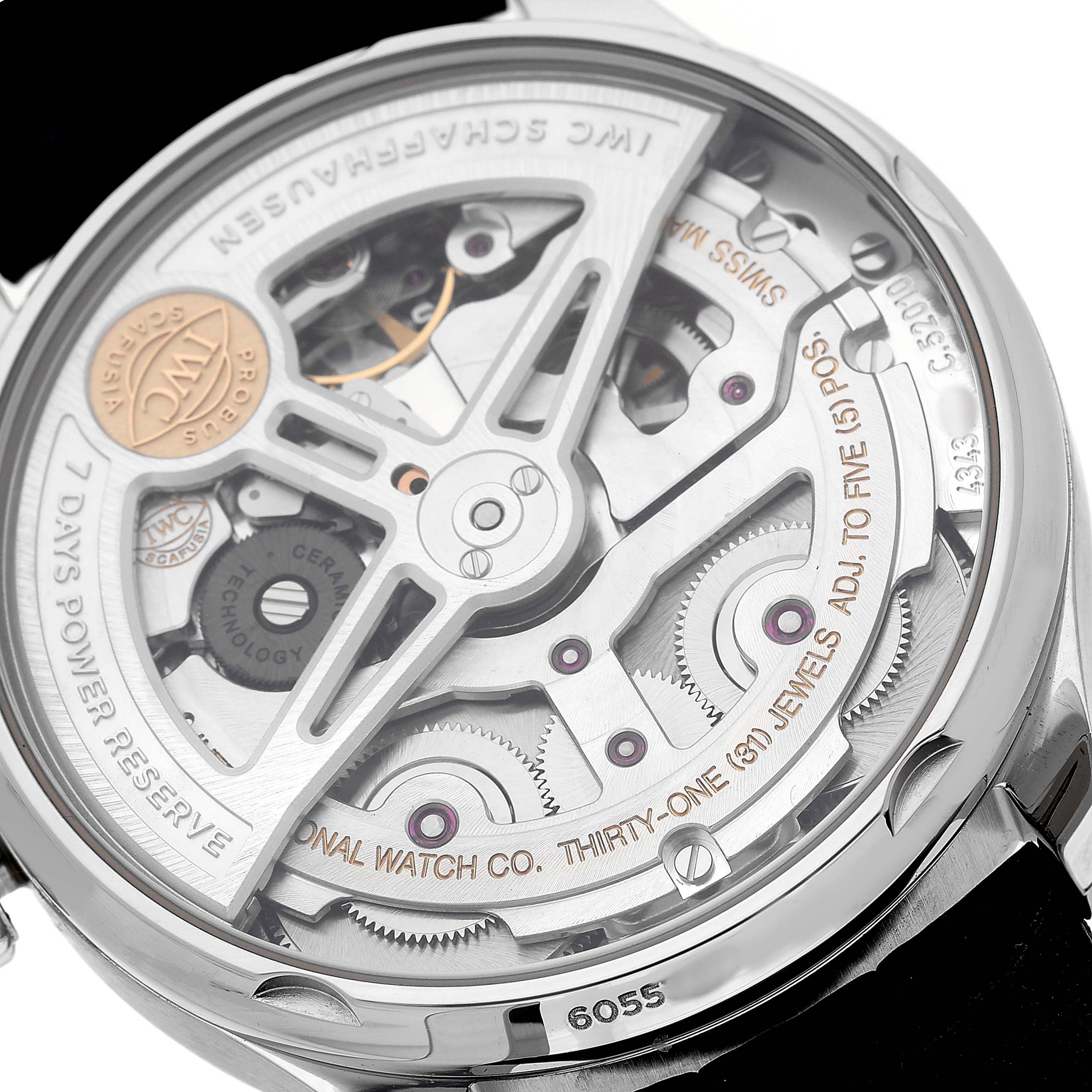 The image shows the back view of the IWC Portuguese IW500710 Men's Stainless Steel Blue Dial model, highlighting its intricate movement details.